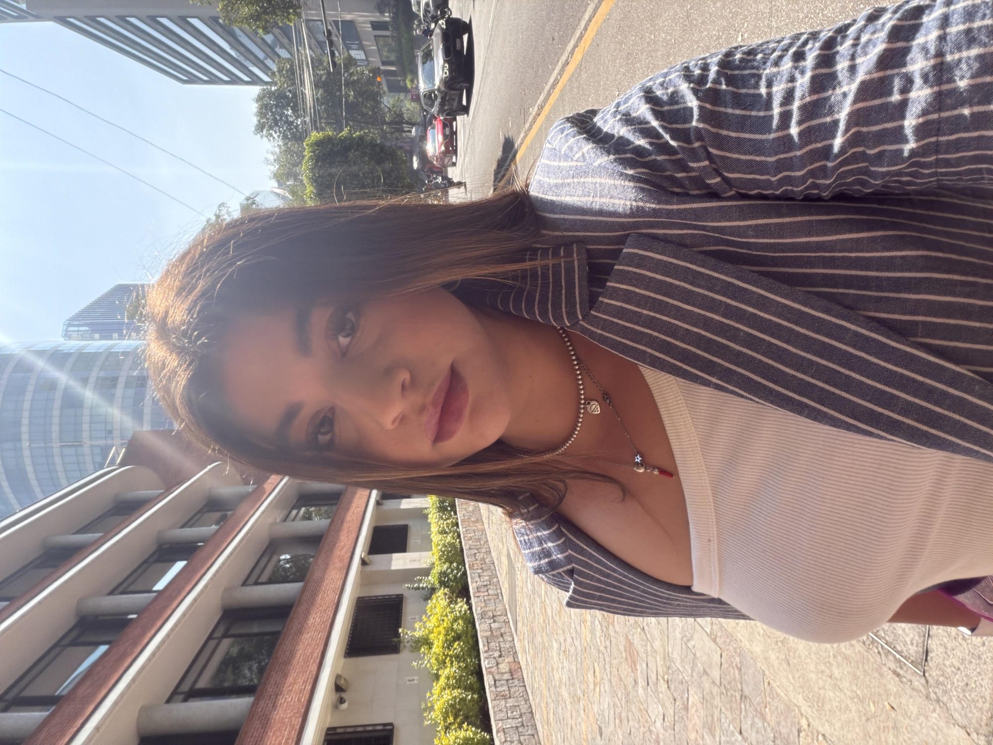 Woman Takes Selfies on Mexico City Sidewalk