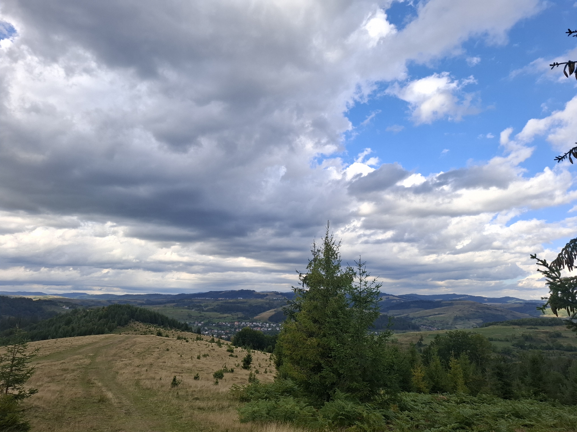 Storm clouds build over rural meadows near Volovets, Ukraine