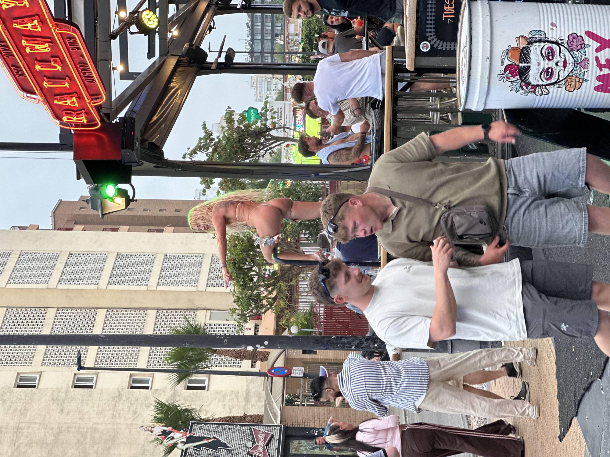 Evening street life documented in Benidorm tourist district