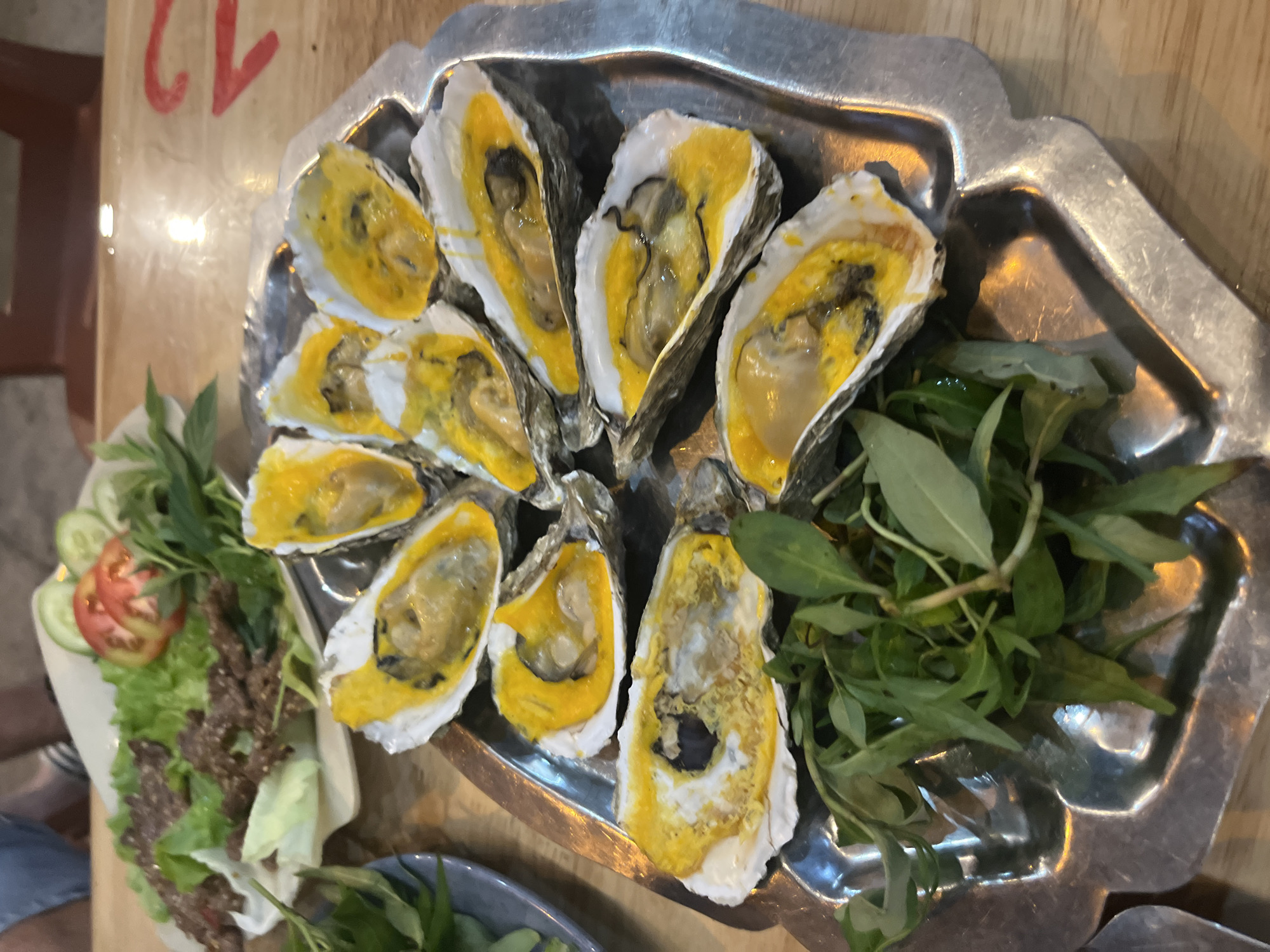 Grilled oysters and fried shrimp at a Nha Trang seafood spot