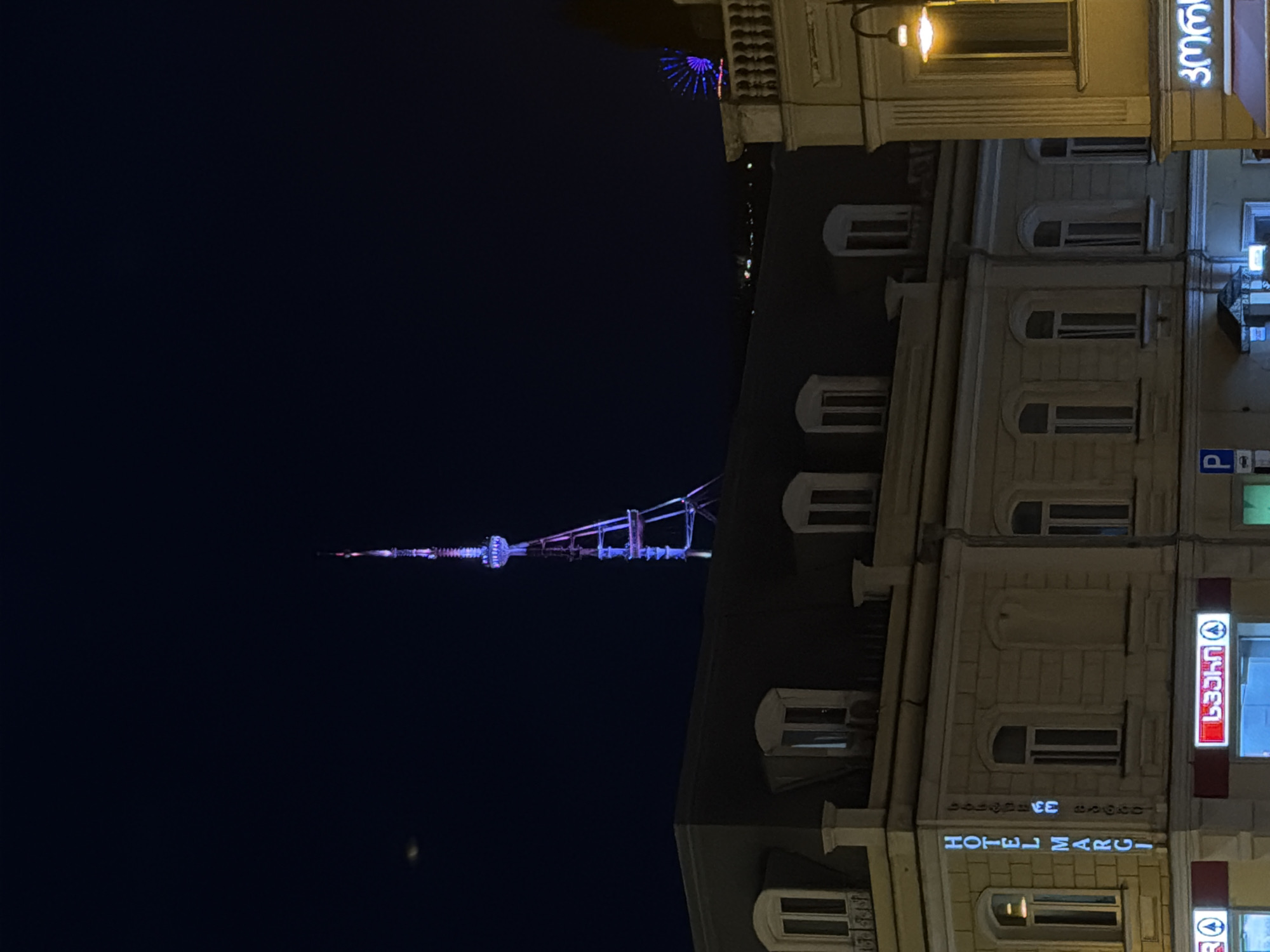 Evening scenes captured across Tbilisi featuring illuminated landmarks, vintage cars