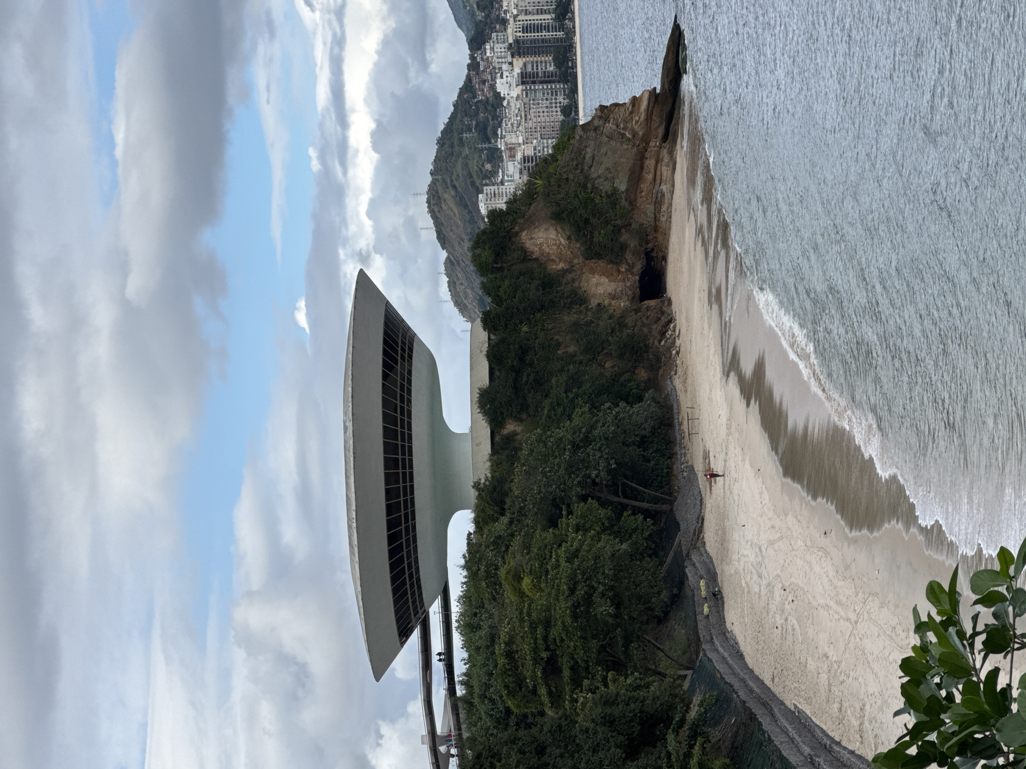 Niterói coastline: art museum, rocky hills, and calm water
