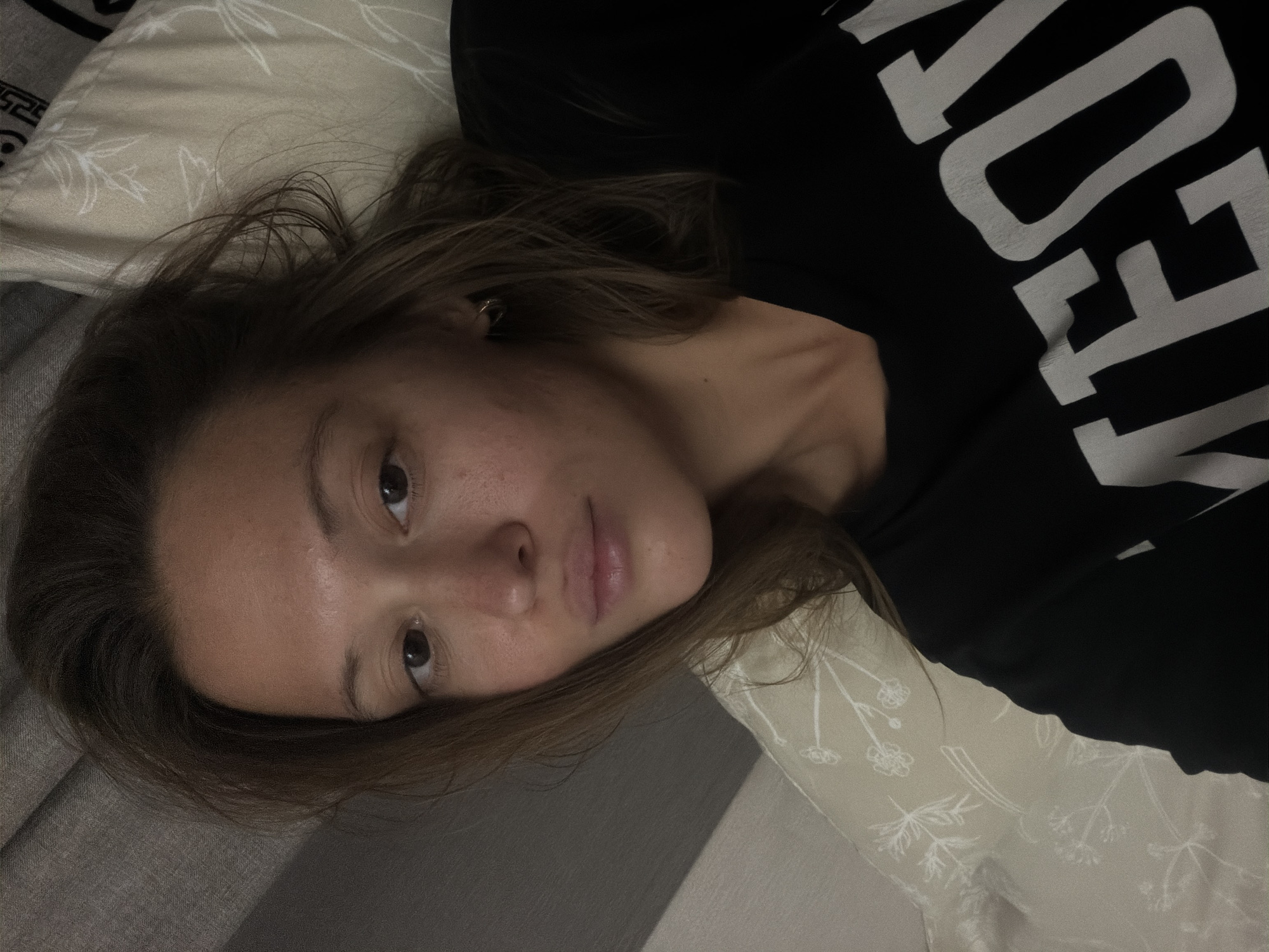Woman resting indoors captured in Nakhodka, Russia