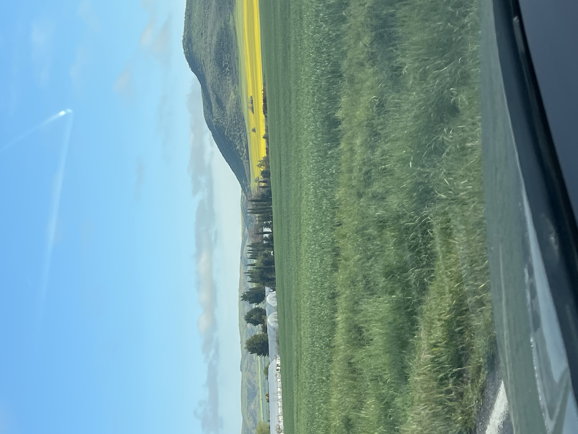 Morning countryside view captured from vehicle near Aytos, Bulgaria