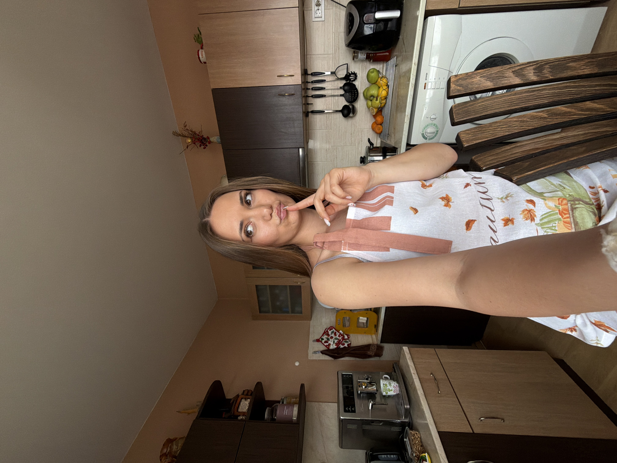 Woman documents kitchen selfies in Buhovo, Bulgaria