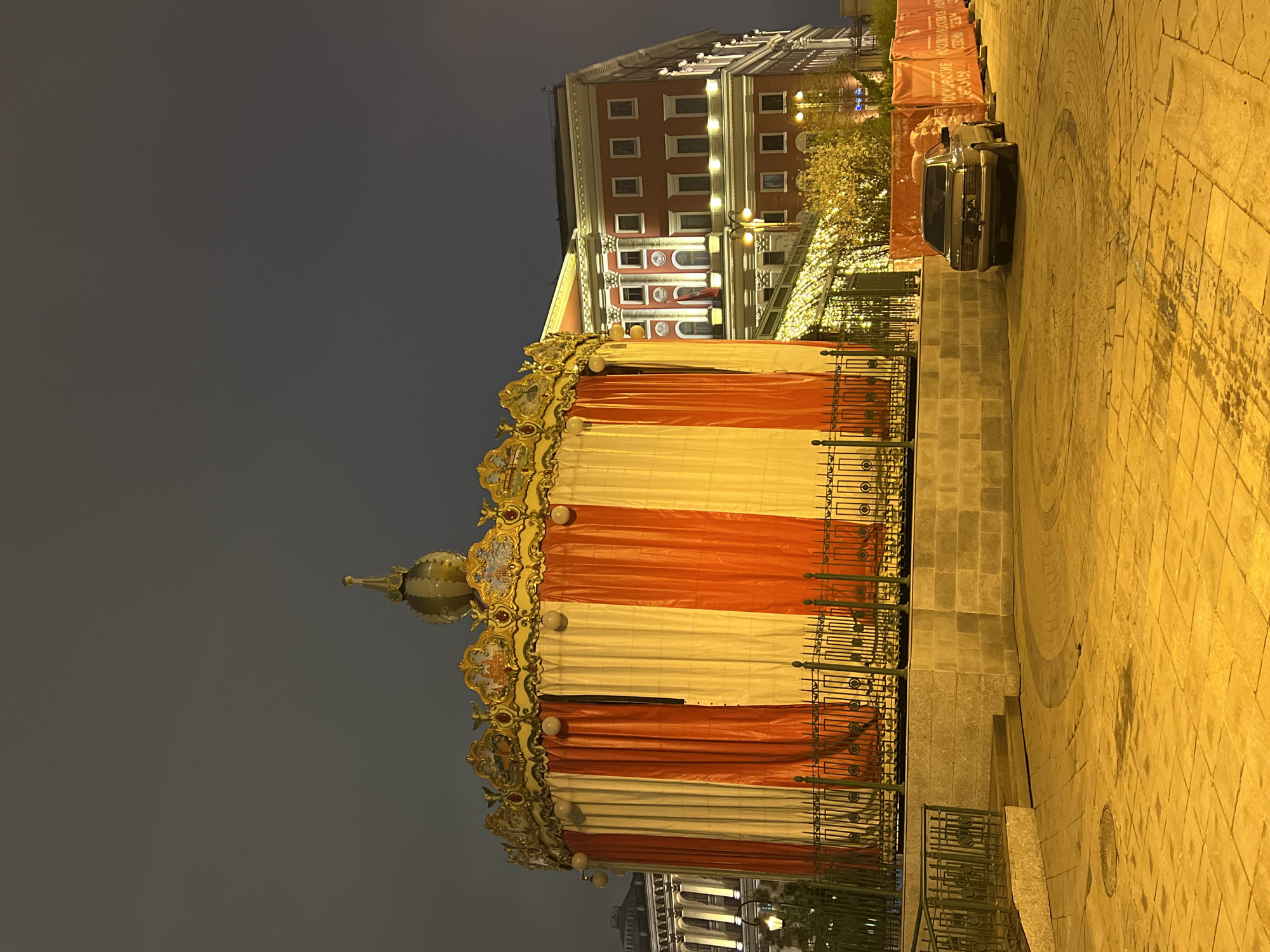 Ornate carousel sits closed in Moscow evening