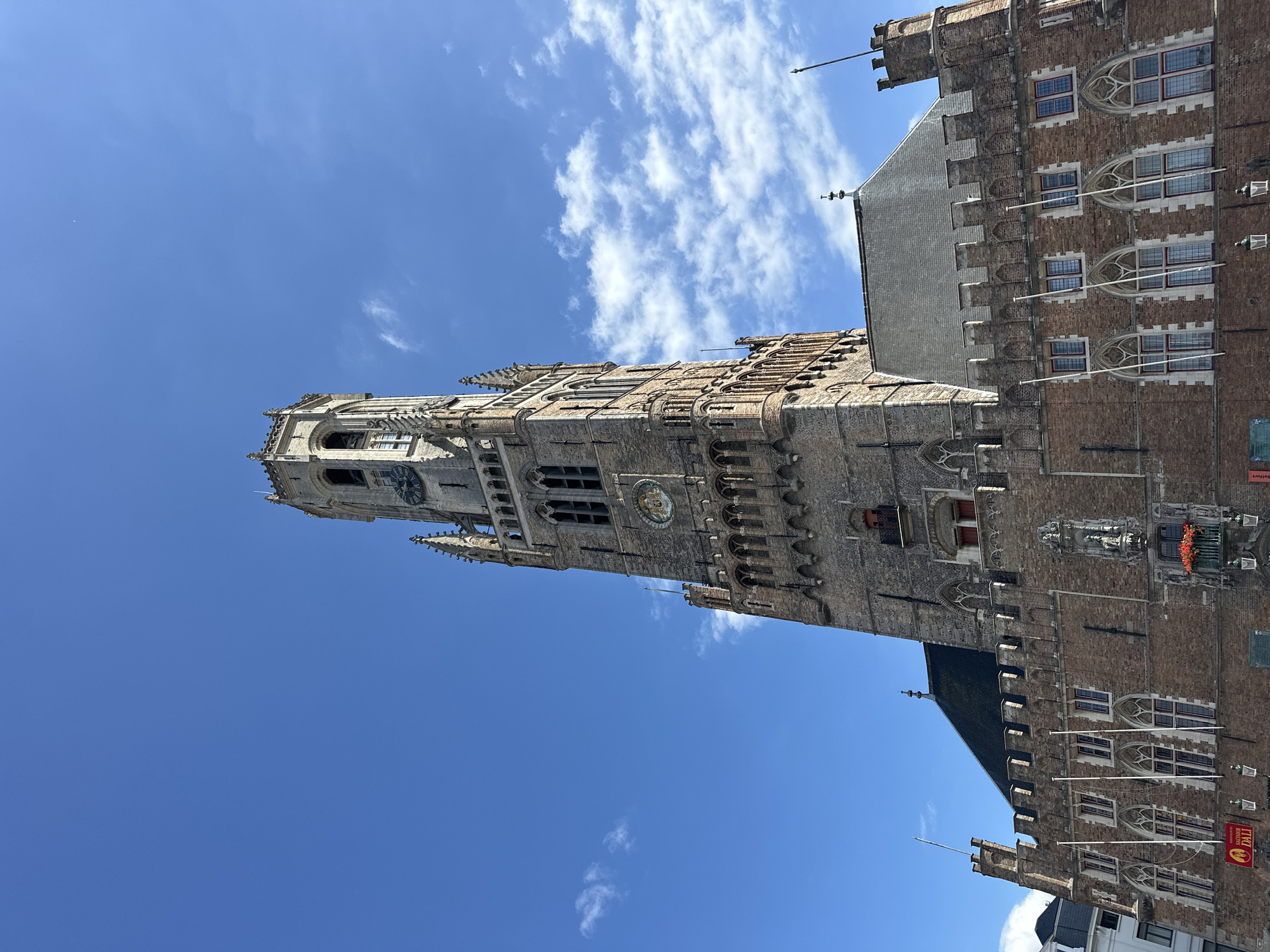 Bruges' Markt Square on a sunny summer afternoon
