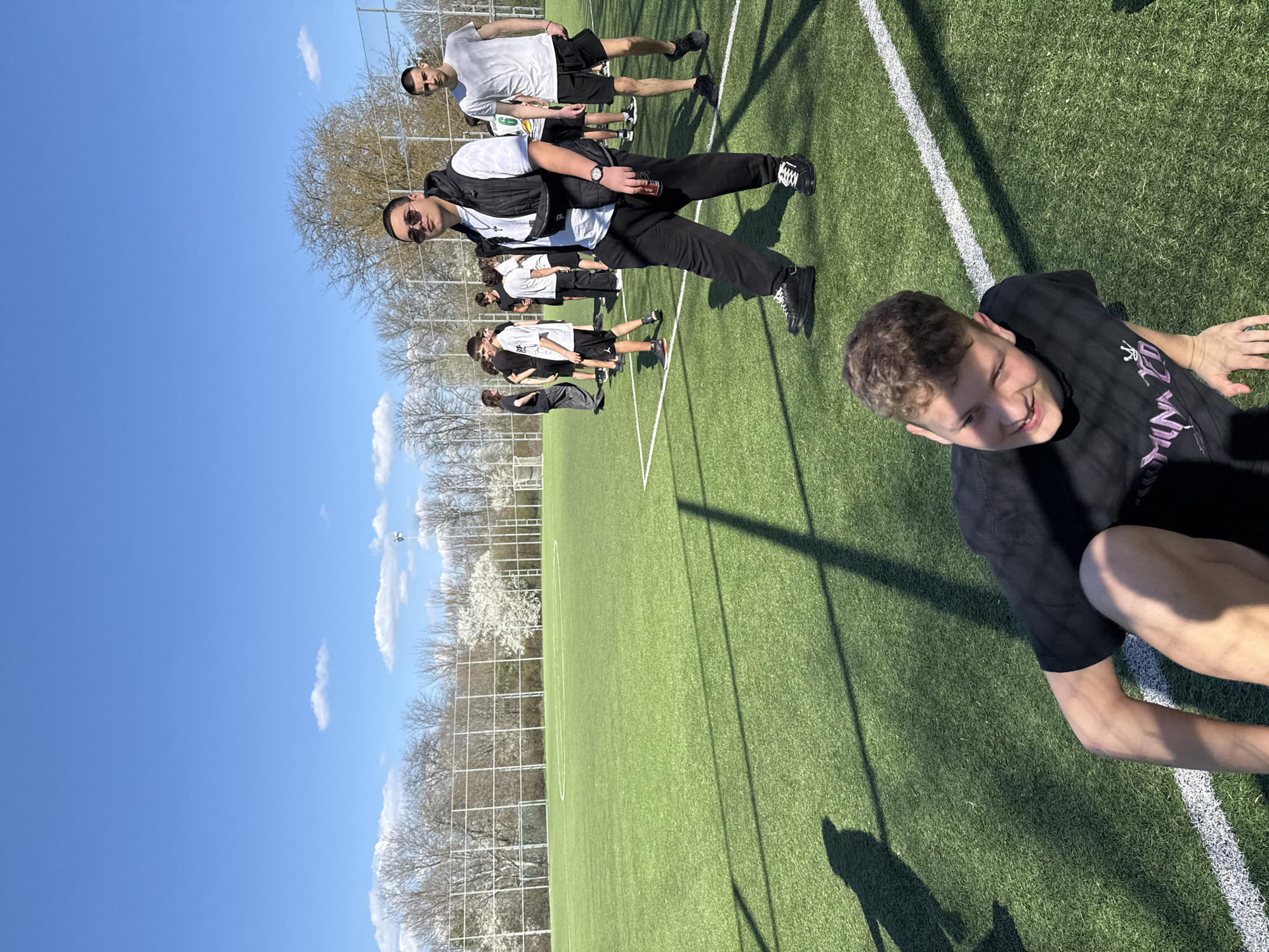 Young men gather on sports field in Dobrich, Bulgaria
