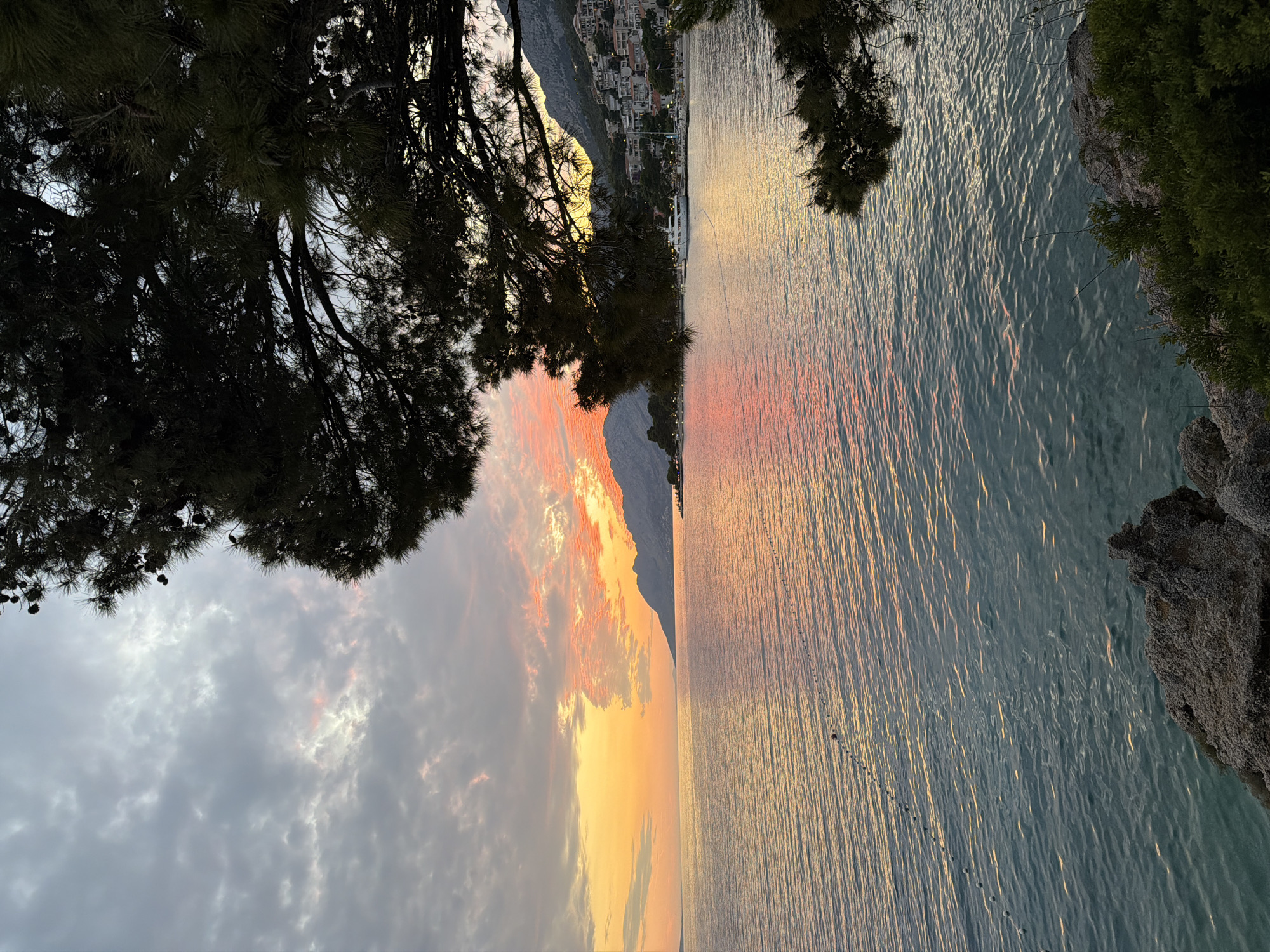 Adriatic sunset paints the sky orange and pink in Brela