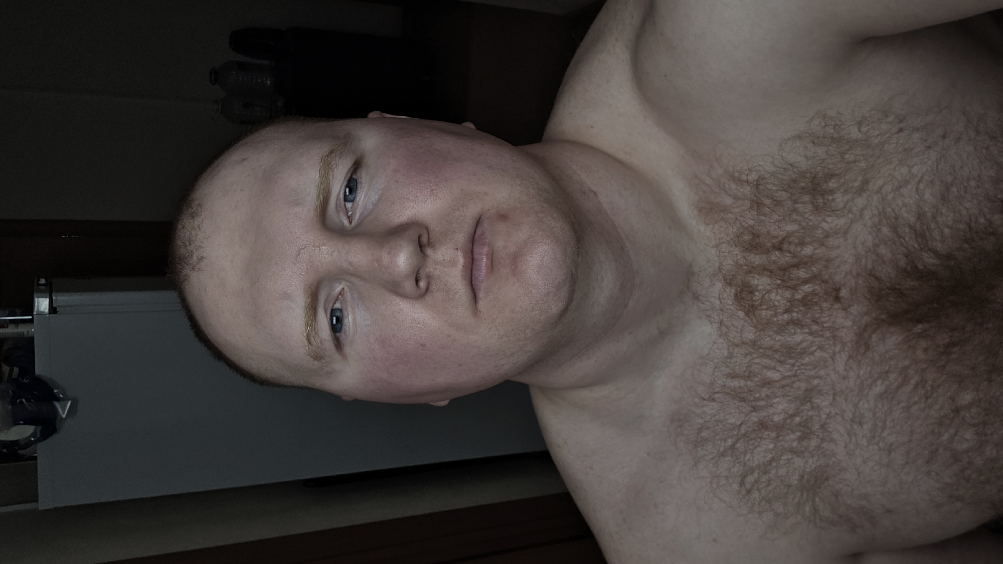 Man takes shirtless selfies indoors in Russia