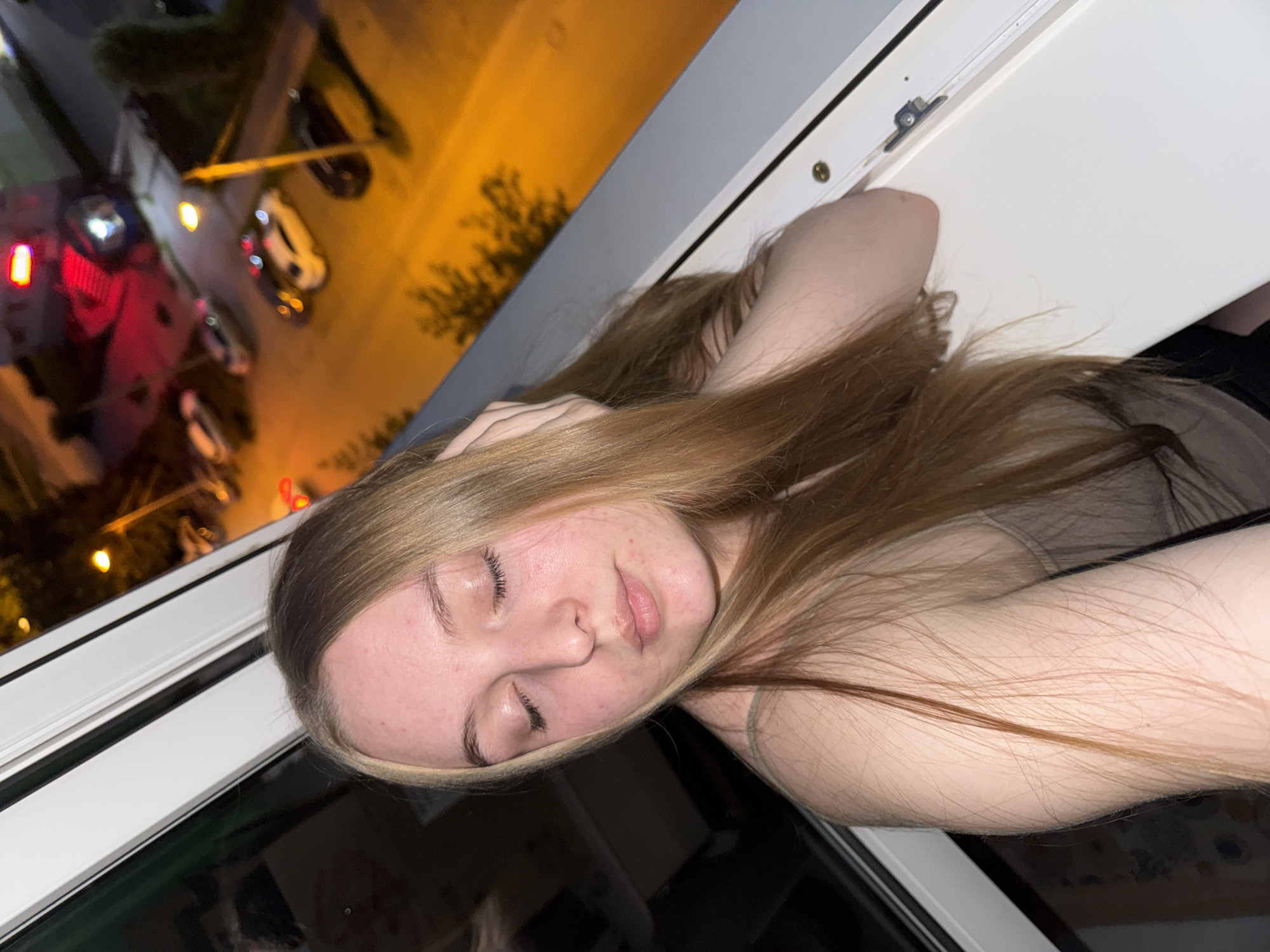 Casual evening portraits and selfies by a window in Perm