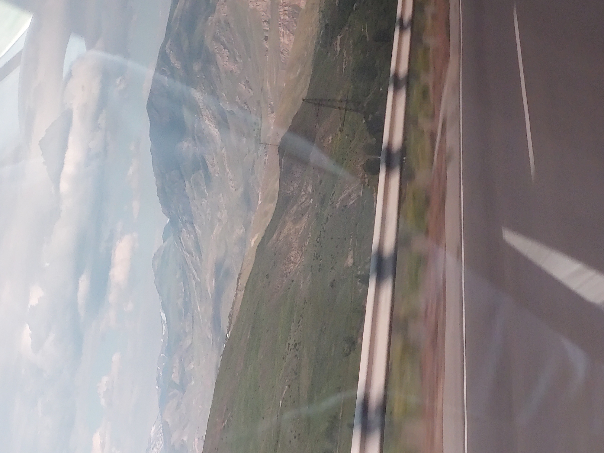 Traveler documents scenic mountain landscape in Chiva, Armenia