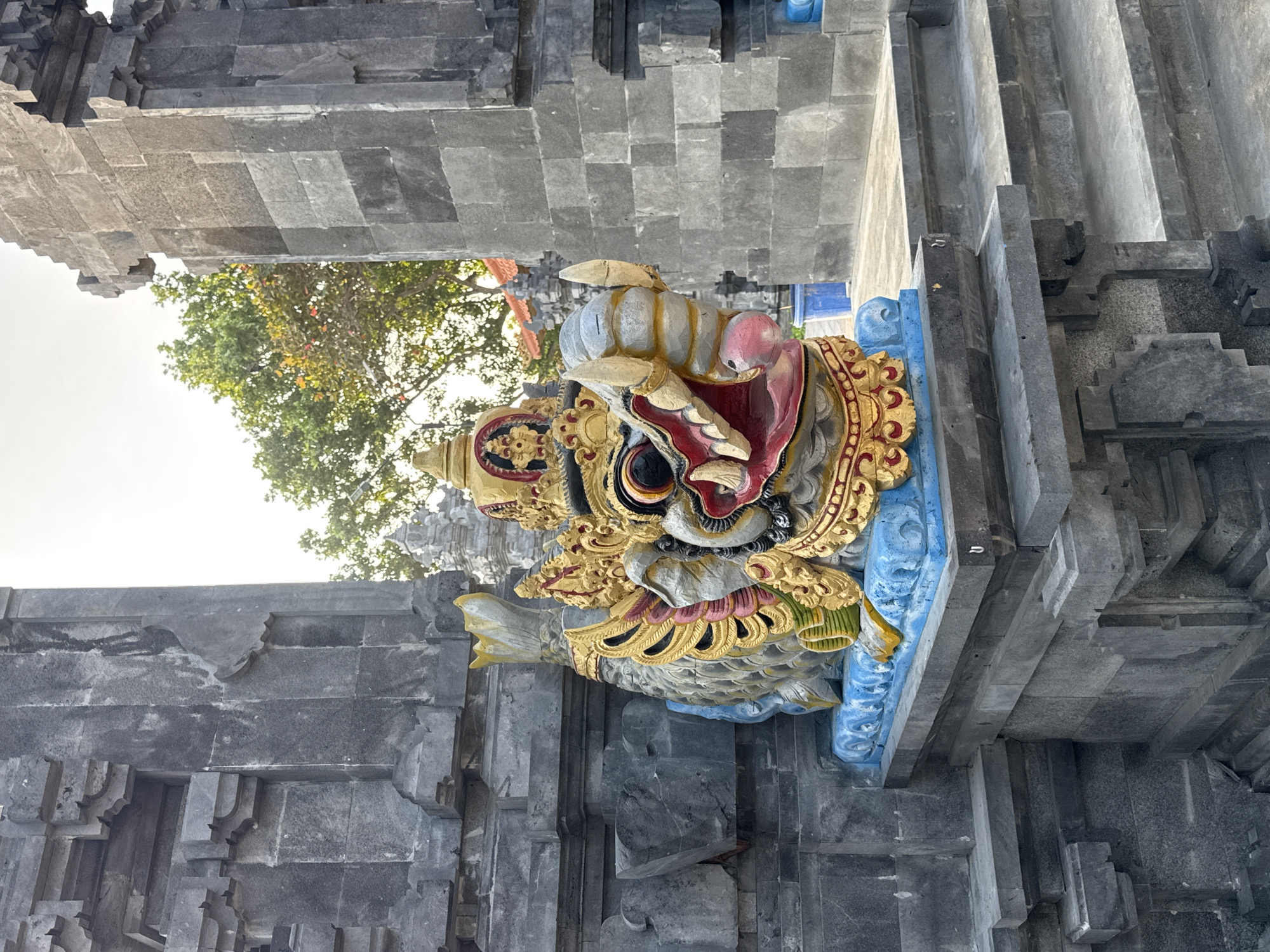 Ornate dragon statue guards a stone temple in Kuta Selatan