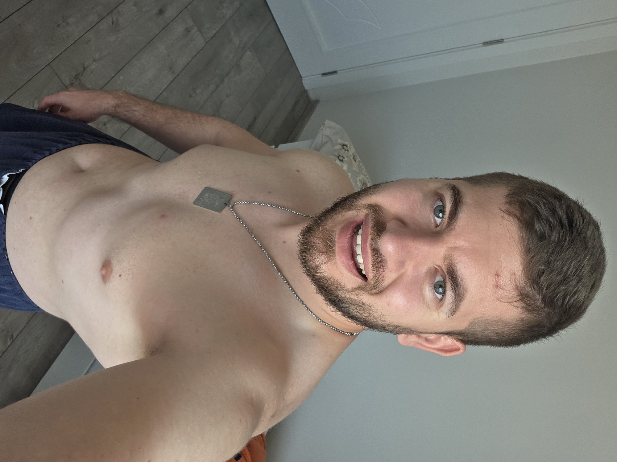 Man poses shirtless in Bulgarian residence during early morning