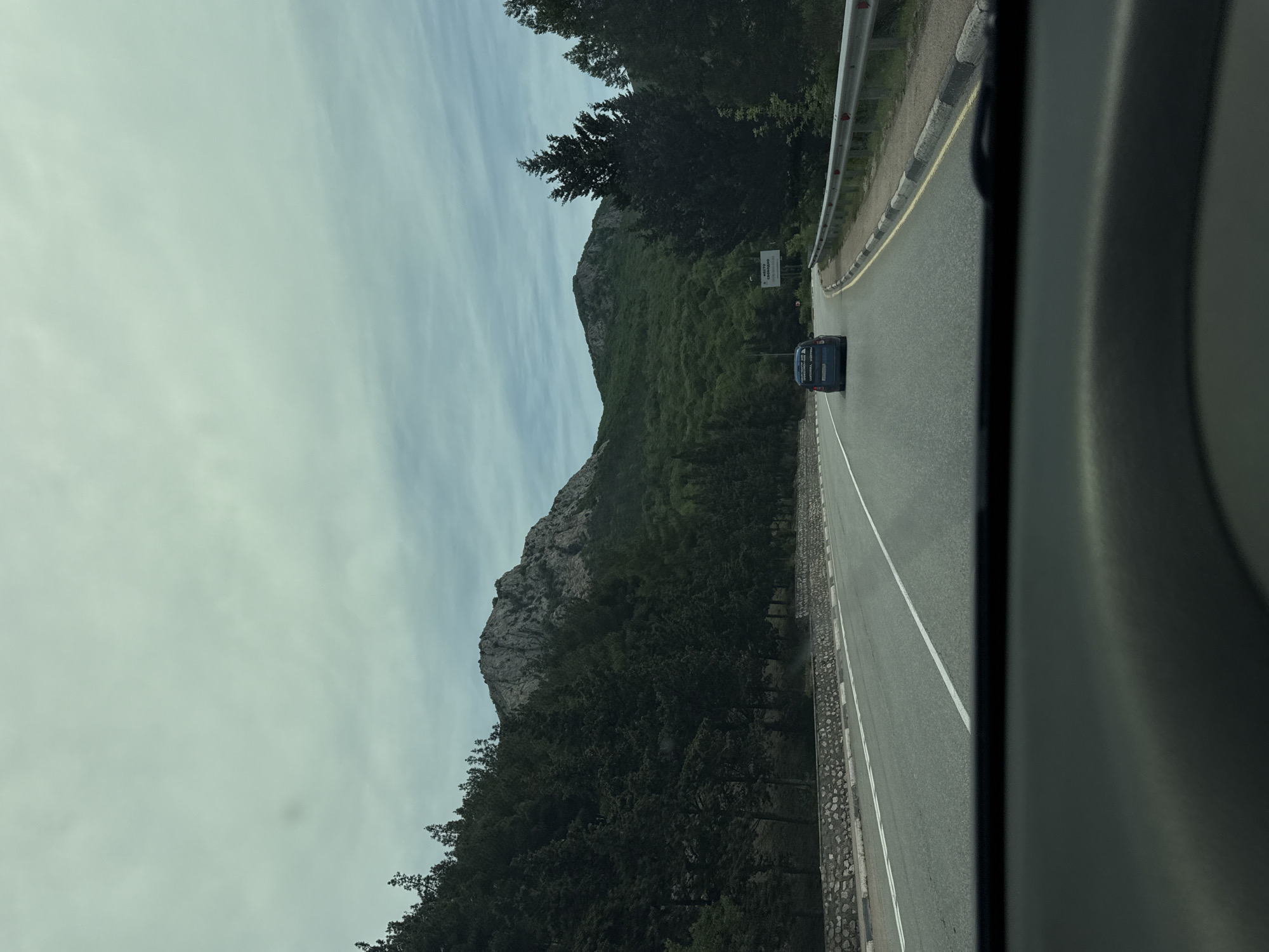 Vehicle travels scenic mountain road in Ukraine
