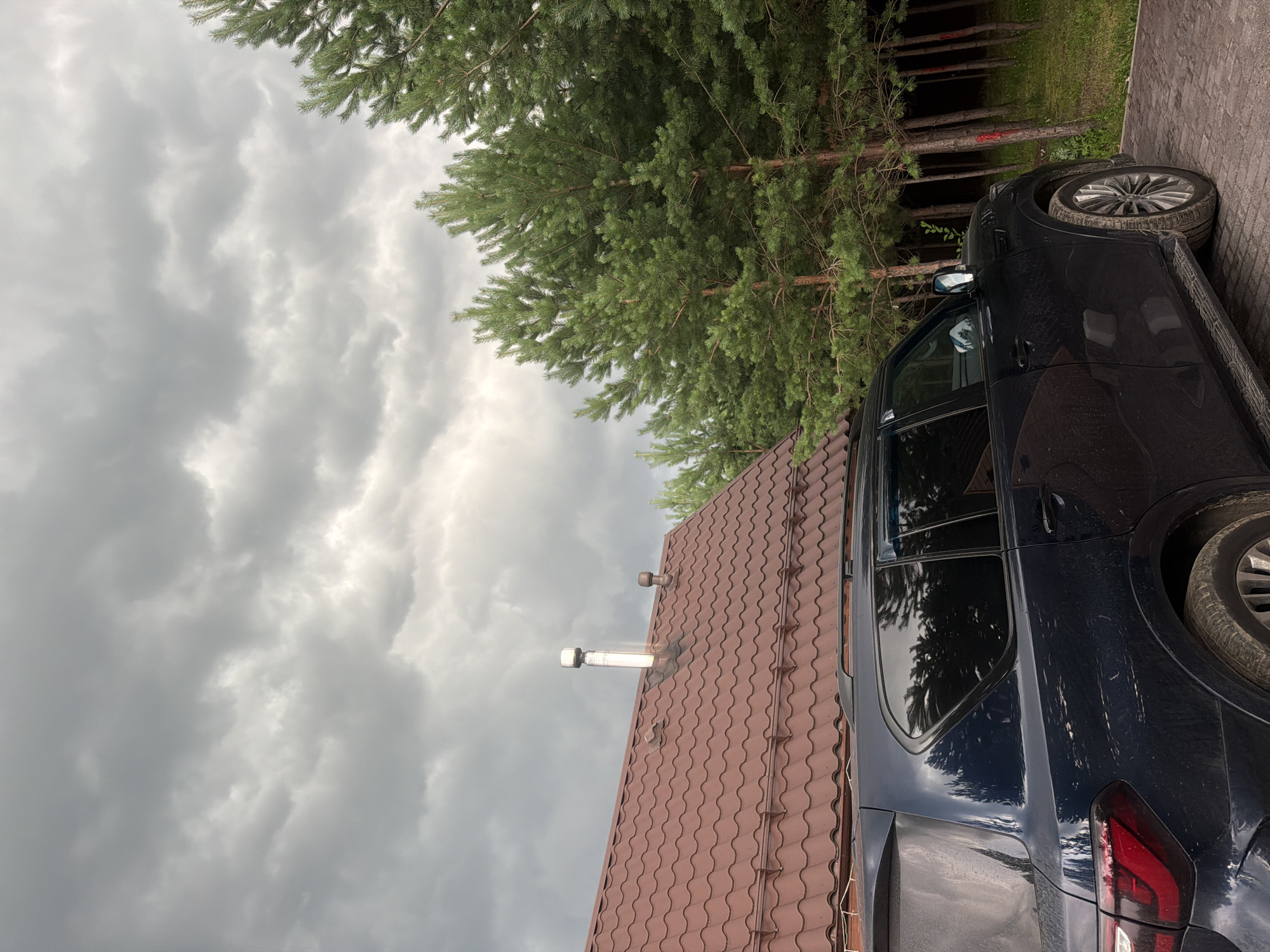 Rainy afternoon in a Russian village backyard