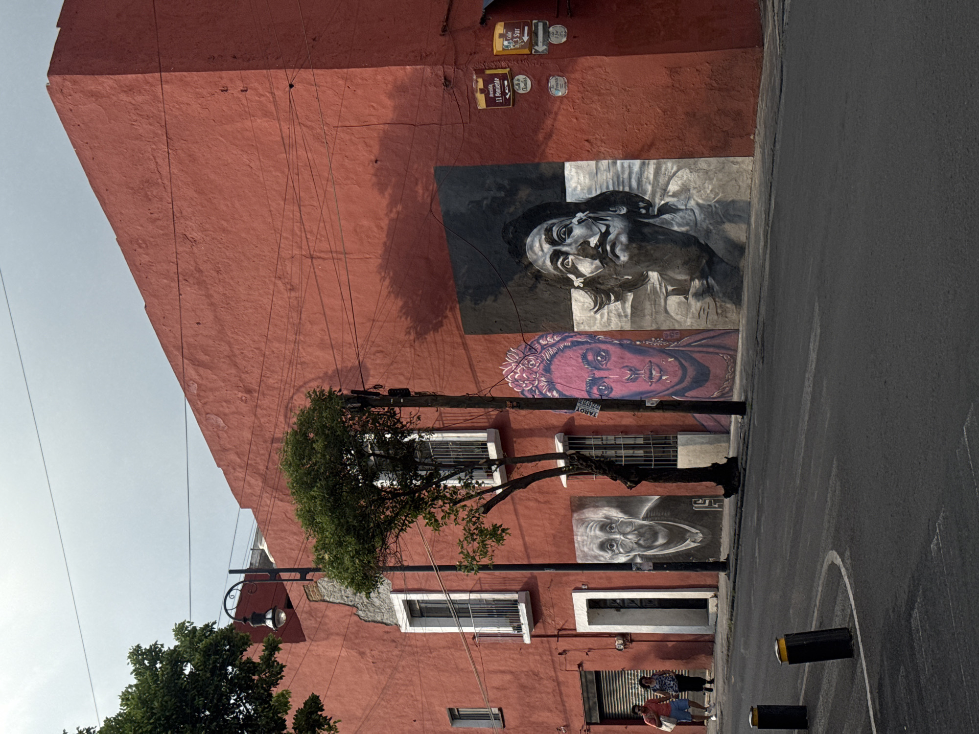 Evening scenes documented across Puebla featuring murals and locals