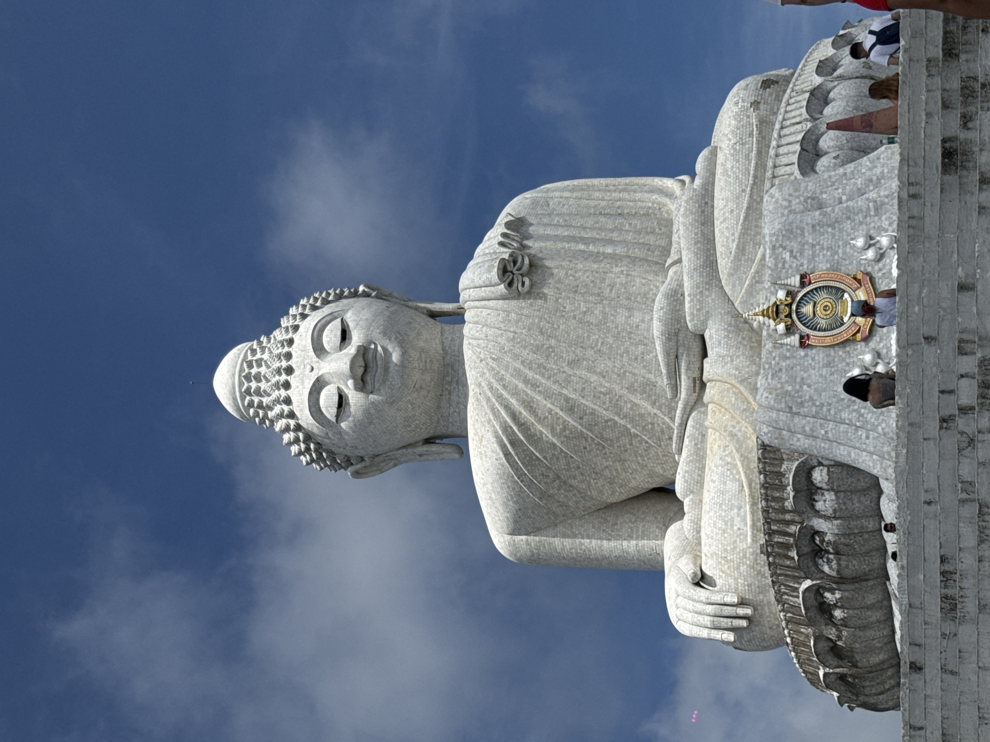 Tourists photograph Great Buddha statue in Chalong, Thailand