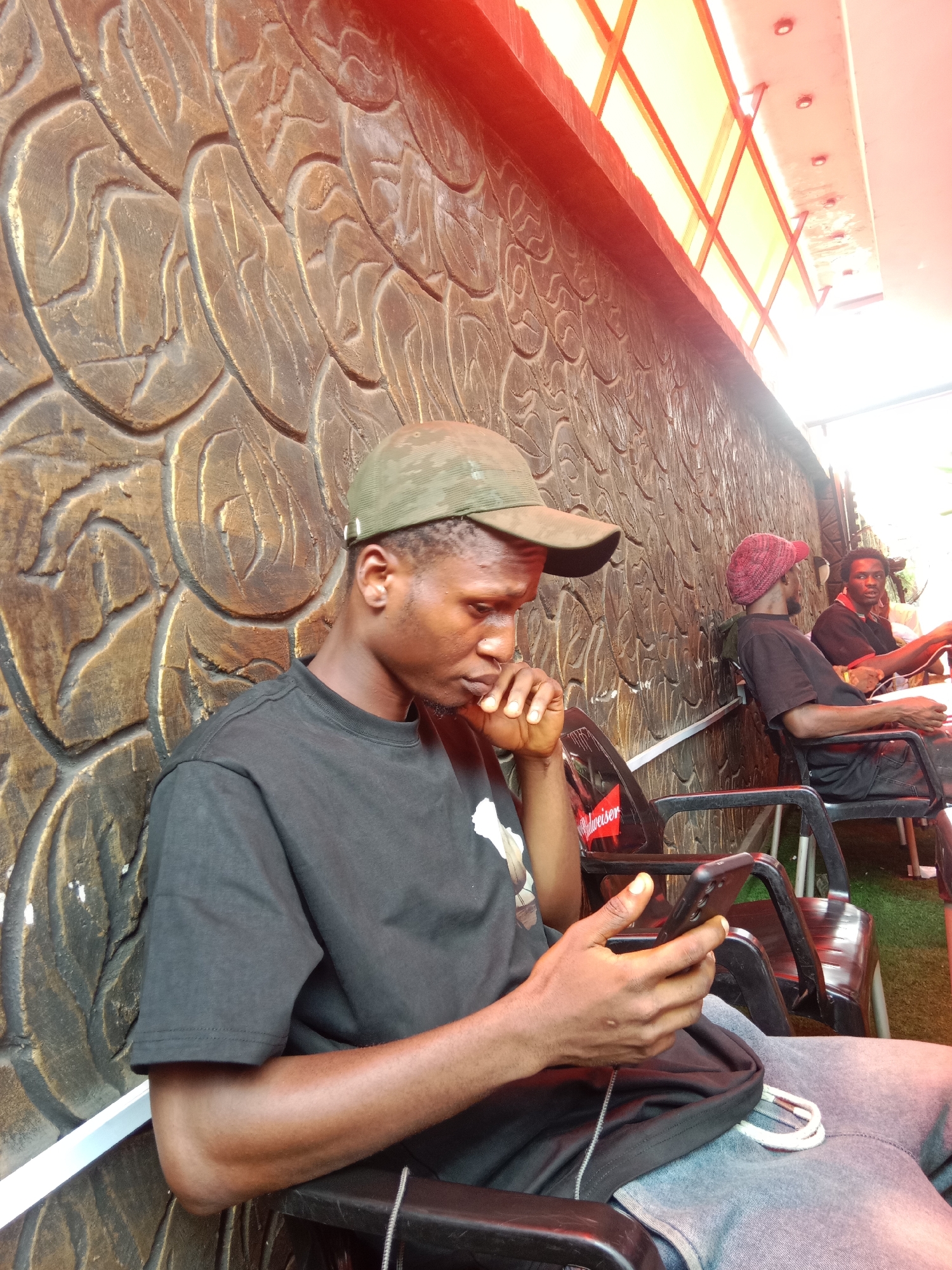 Men gather at outdoor venues in Onitsha, Nigeria