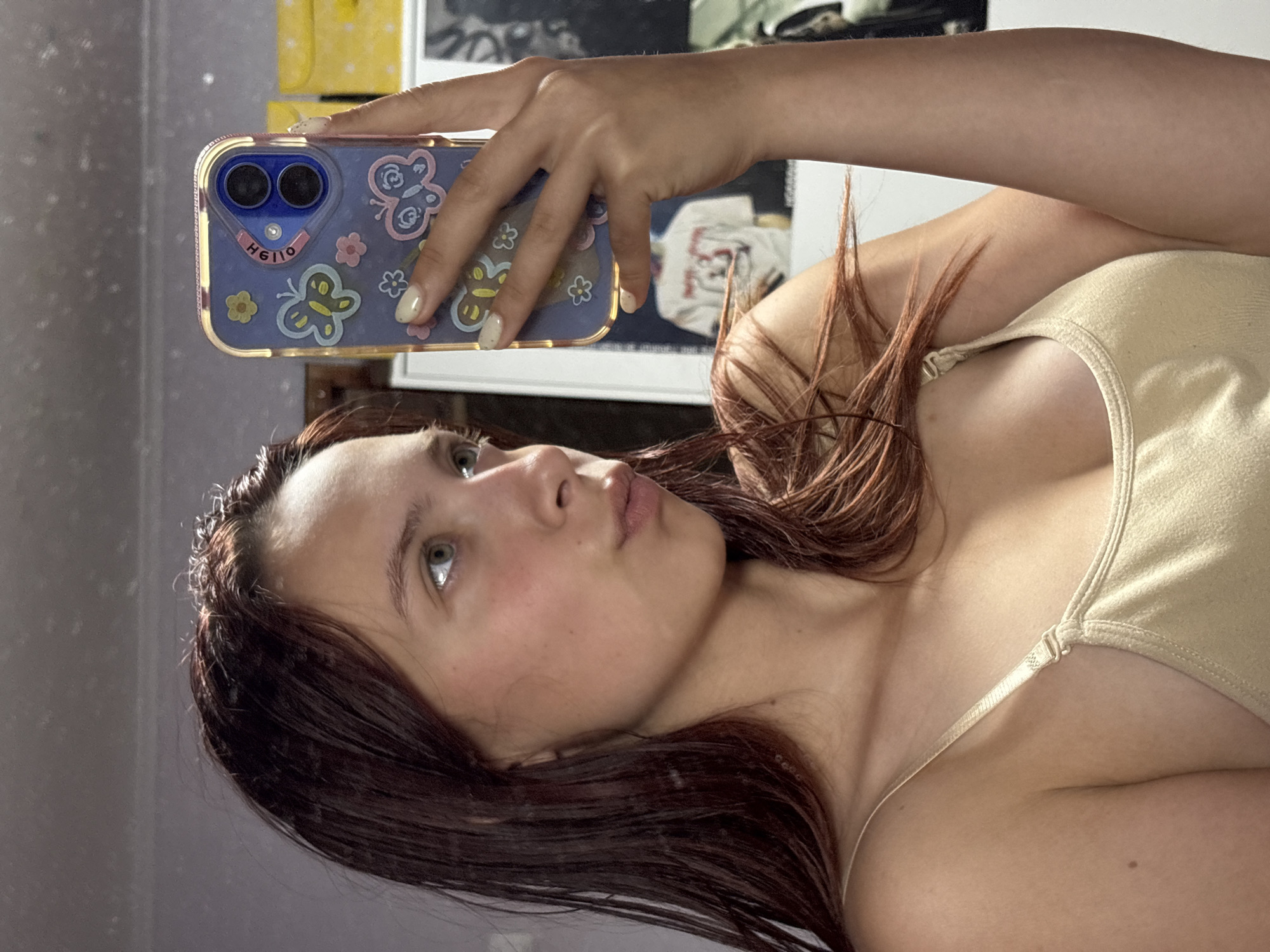 Woman takes morning selfies in Russian bedroom