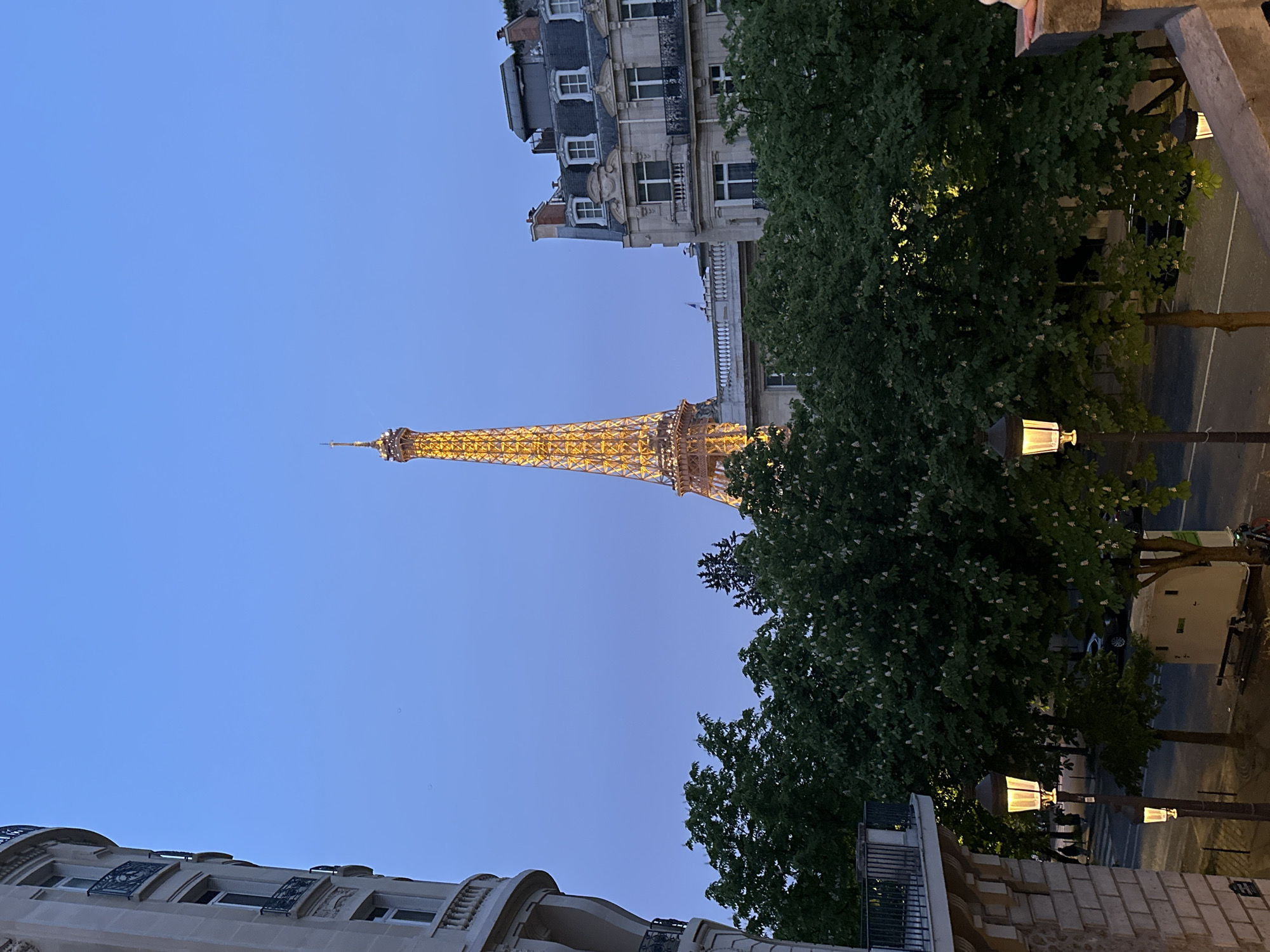 Eiffel Tower illuminated at dusk in Paris