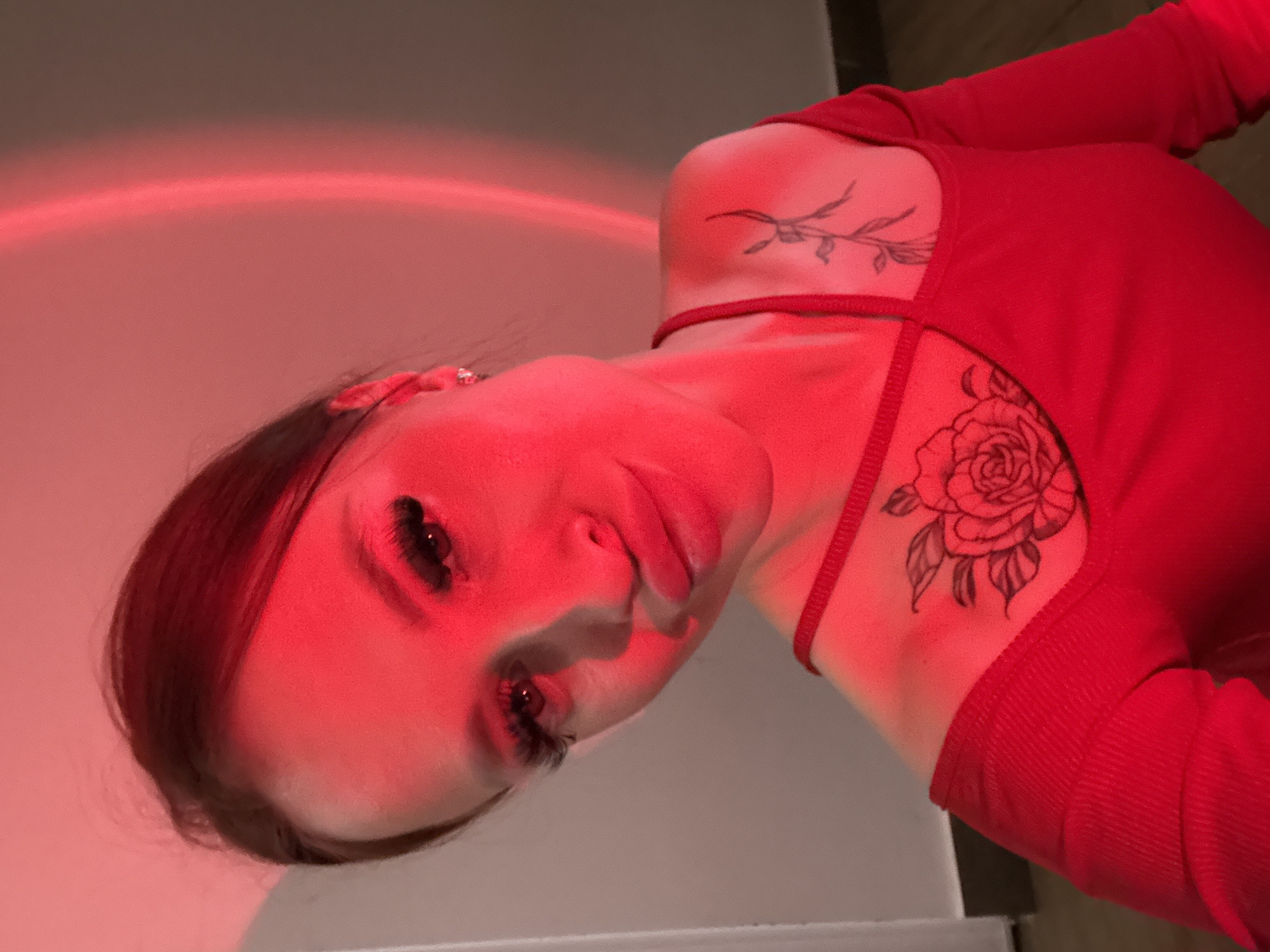 Woman takes artistic selfies with colored lighting in Simferopol