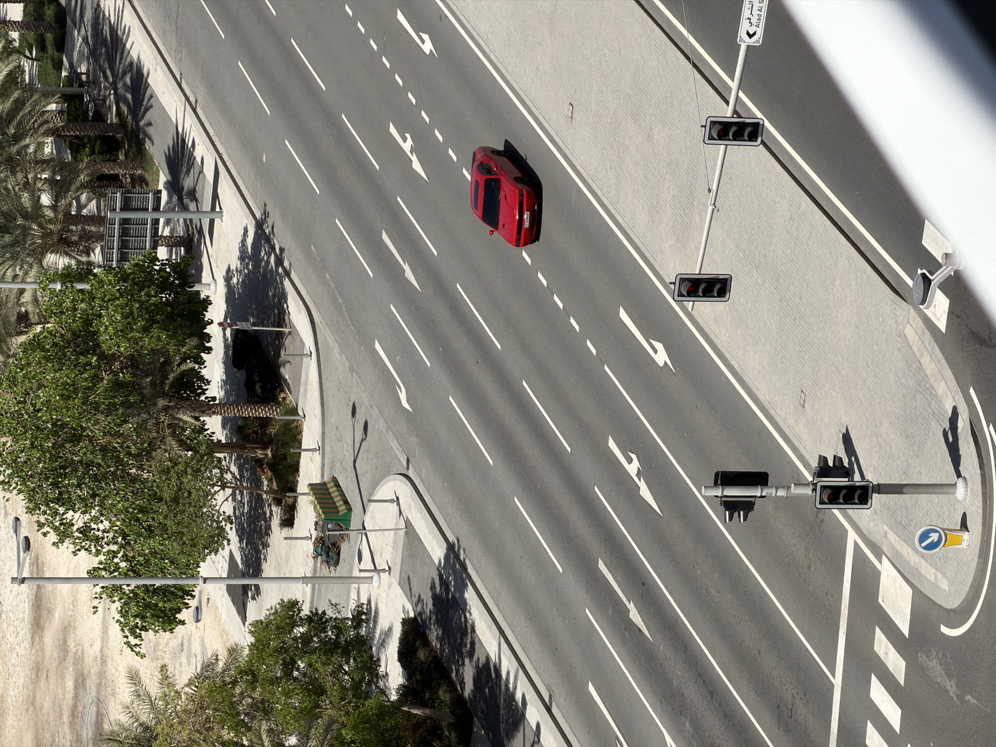 Driving and city views across a sunny Gulf morning