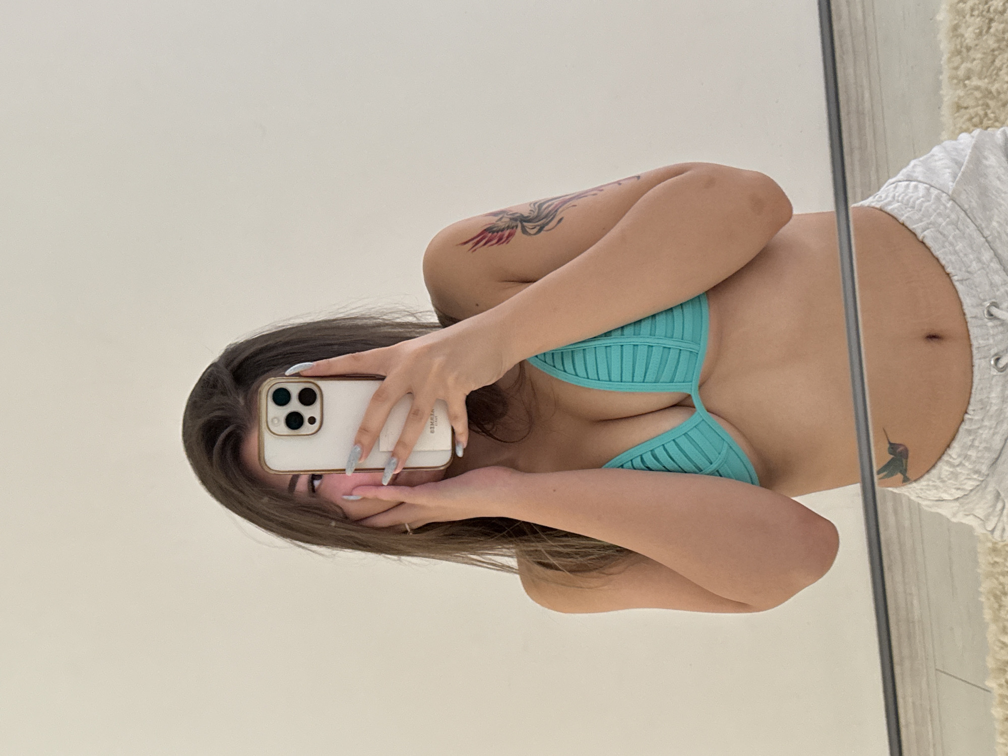 Woman takes mirror selfie in Sofia apartment