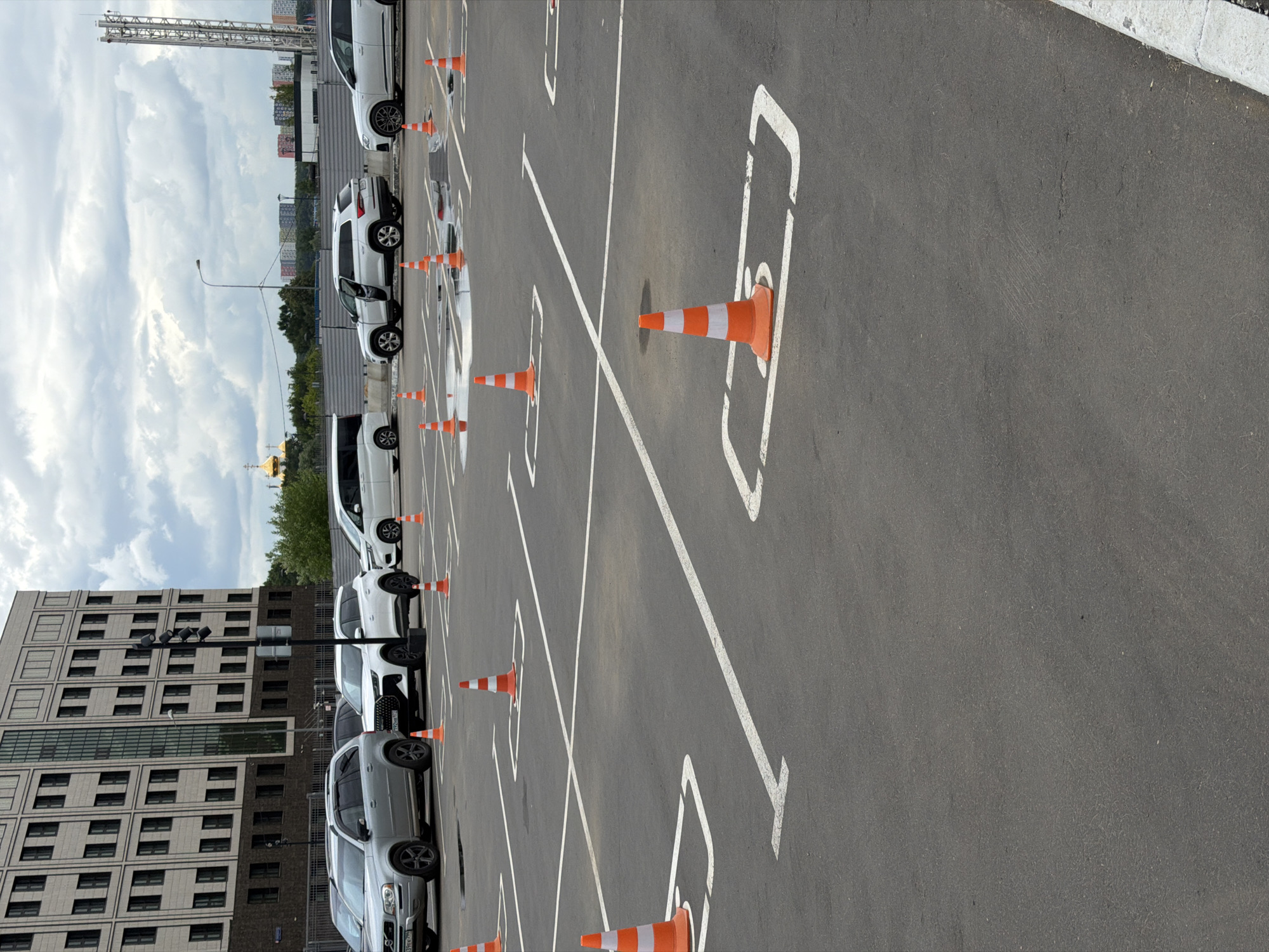 Coned-off parking lot under grey Moscow skies