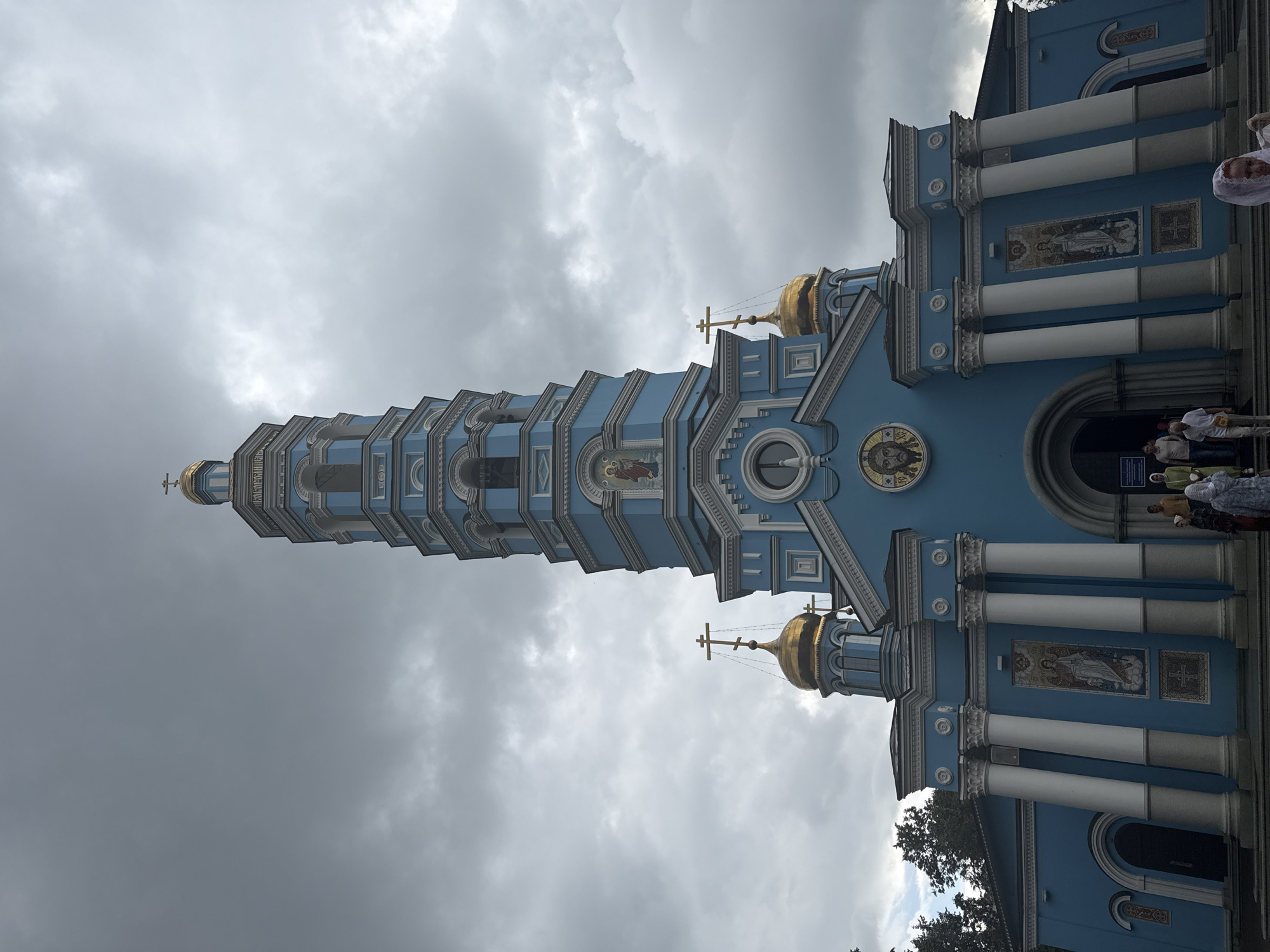 Religious sites and ornate floral arrangements in an urban setting