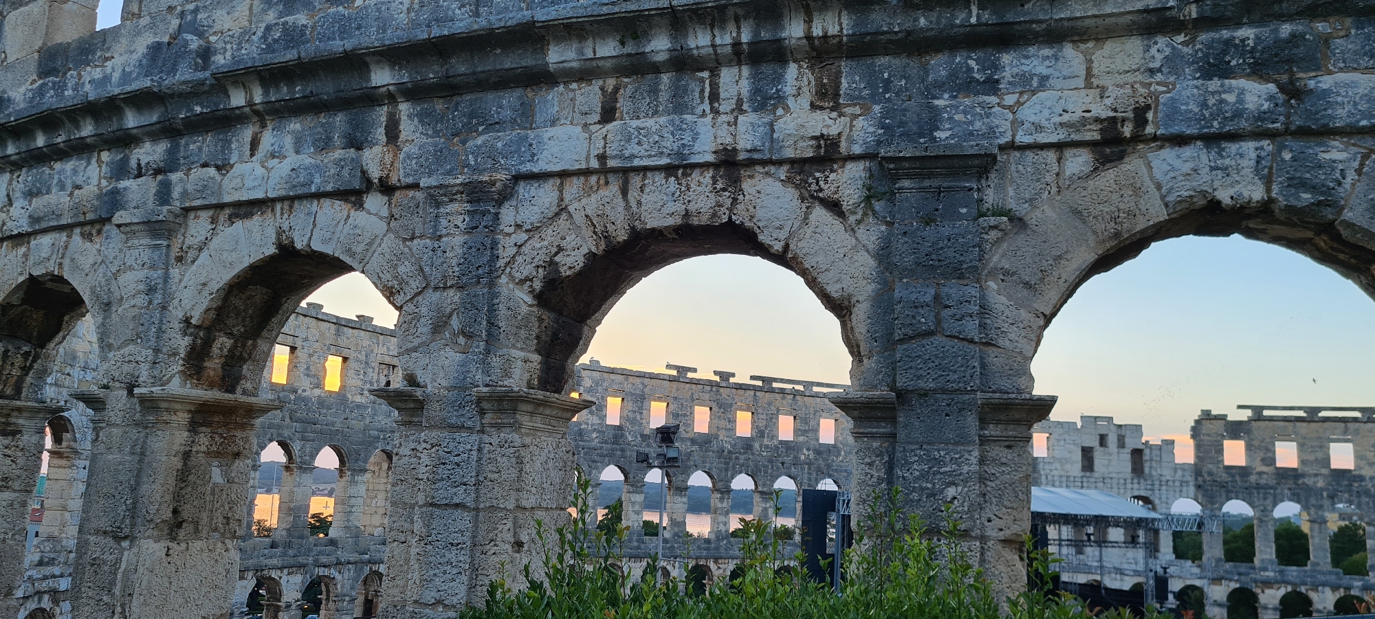 Sunset evening around Pula's Roman amphitheater and harbor