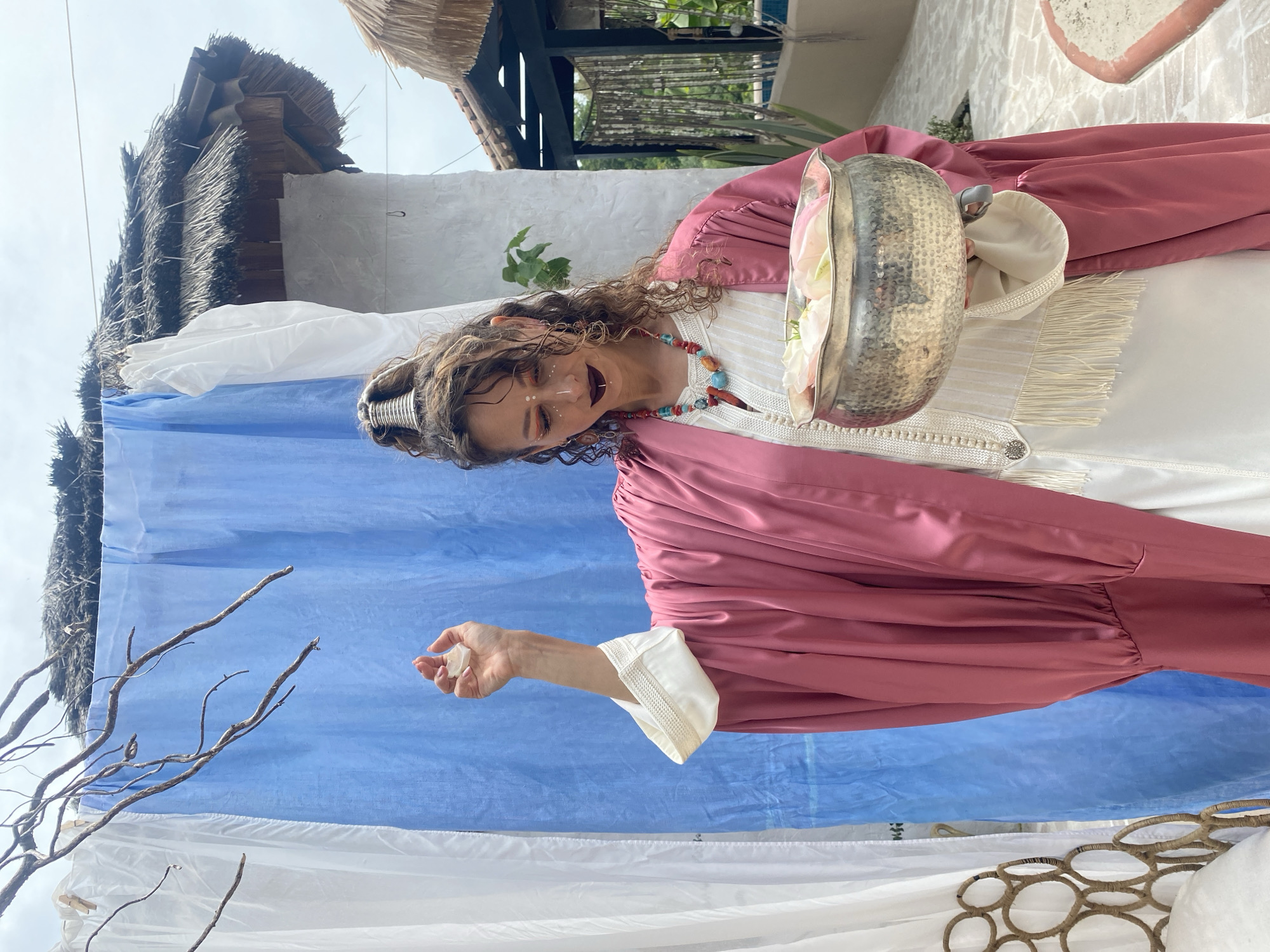 Woman performs traditional flower petal ceremony in Sochi