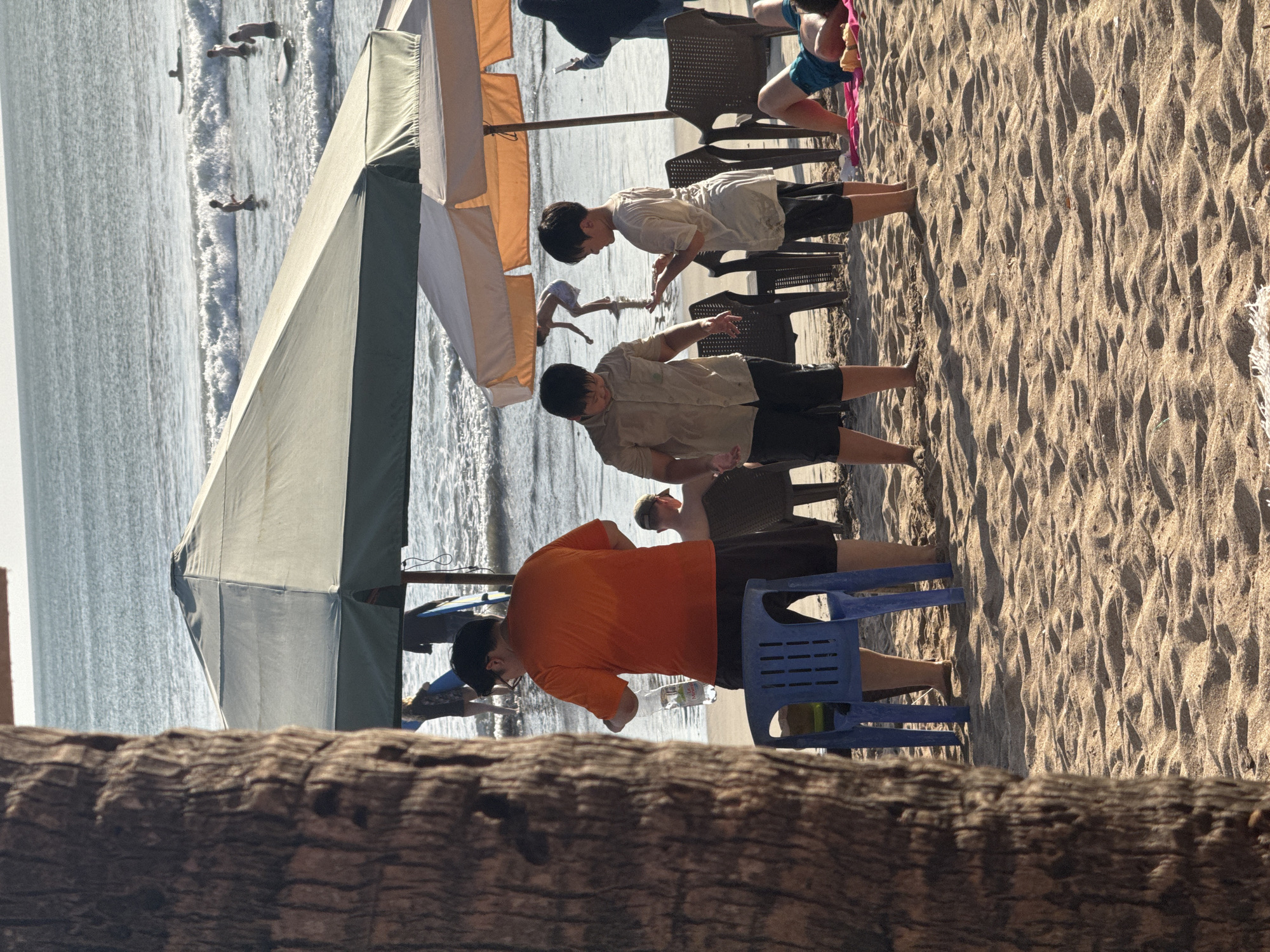 Busy morning on the sand at Kuta Beach