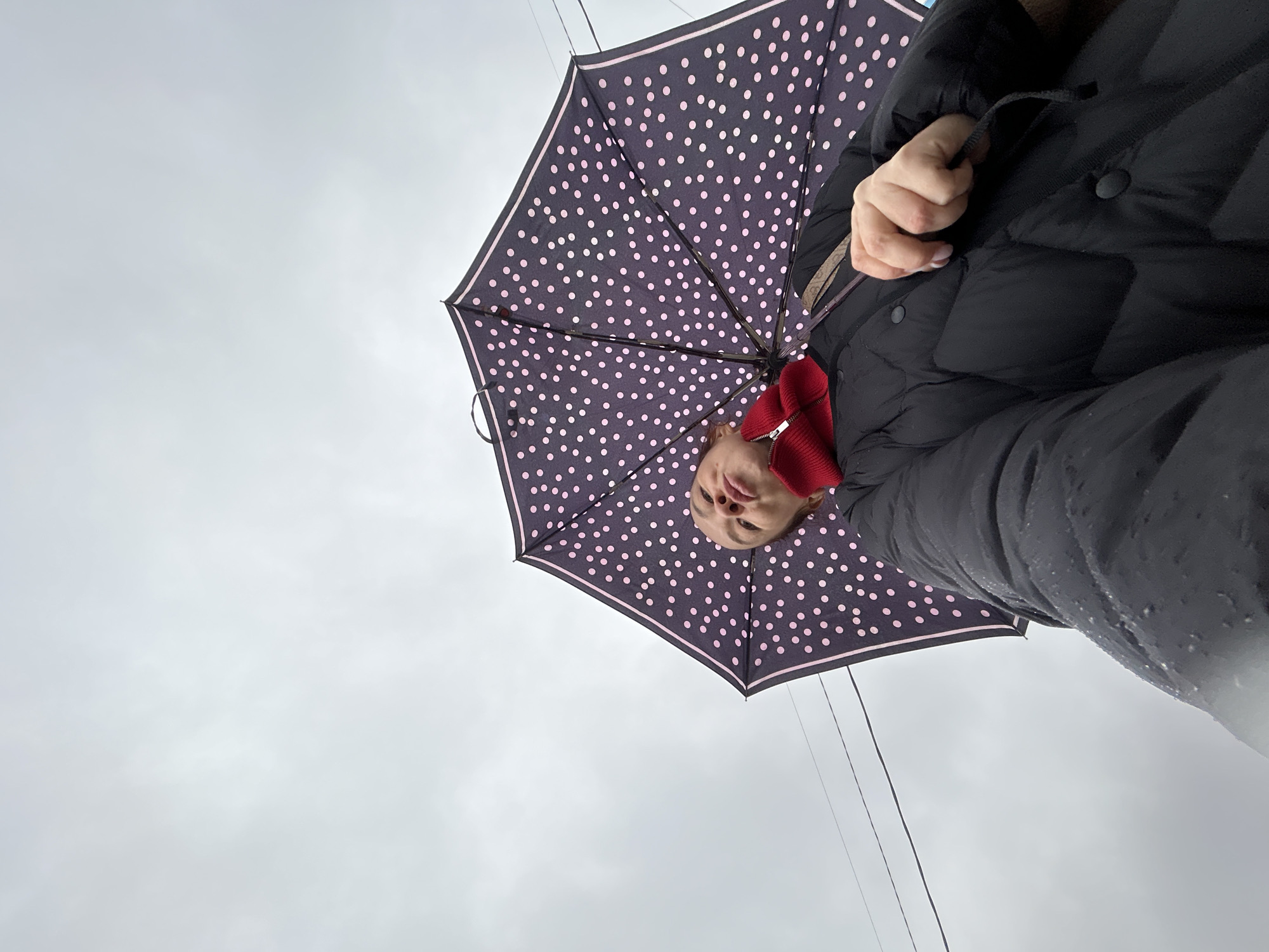 Rainy morning scene captured with umbrella in Chaikovsky, Russia