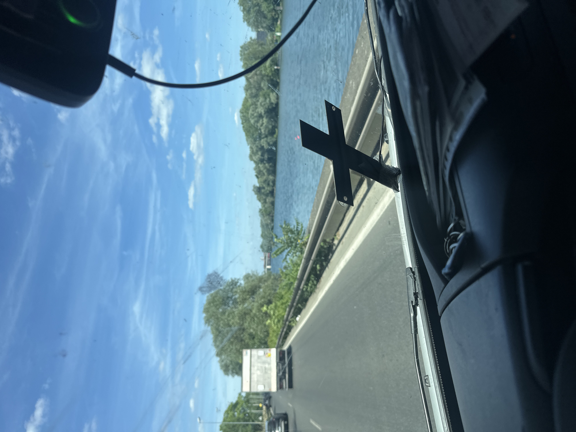 Highway traffic observed alongside river in Argenteuil, France