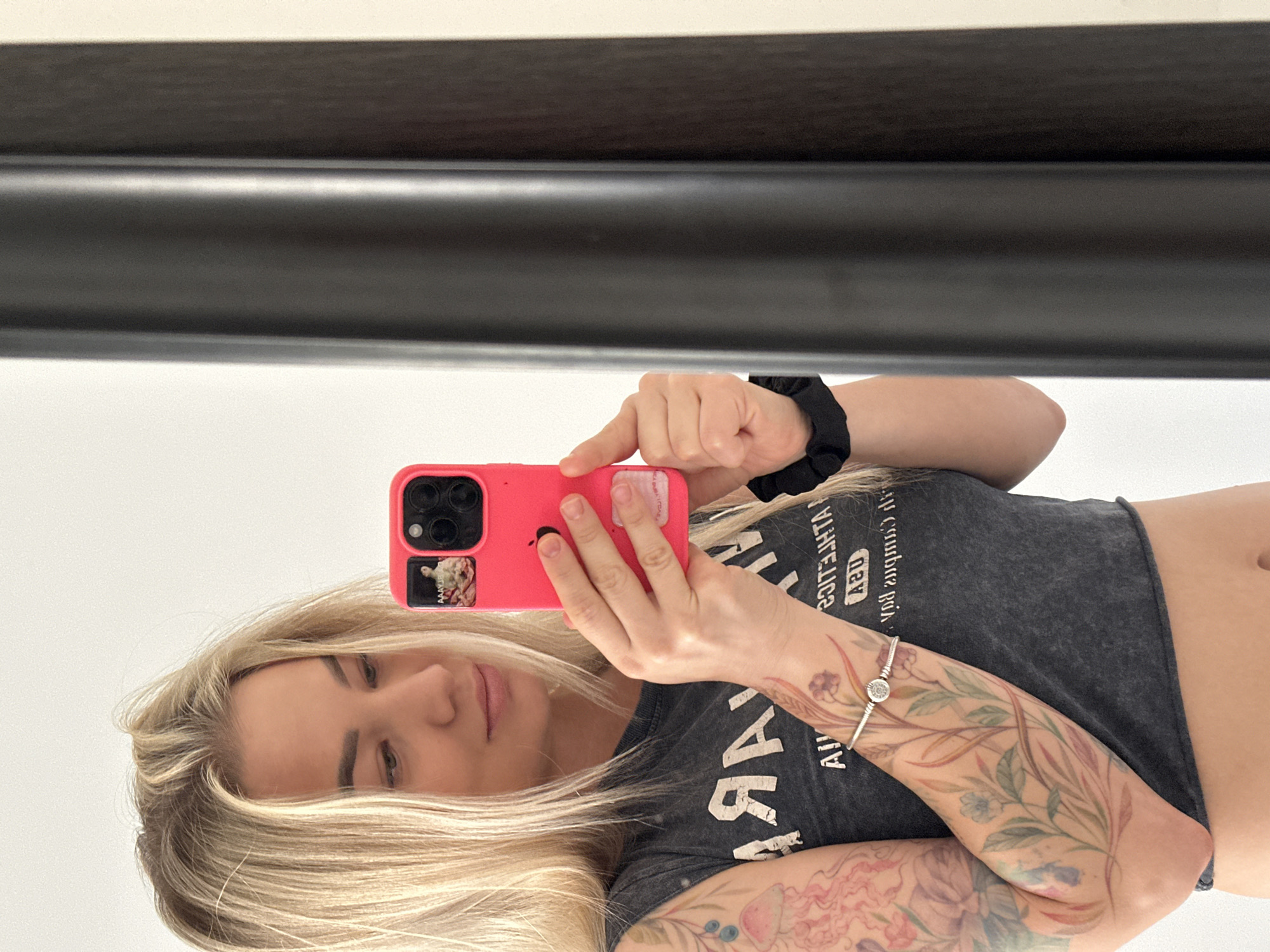 Woman takes multiple mirror selfies in Budva, Montenegro