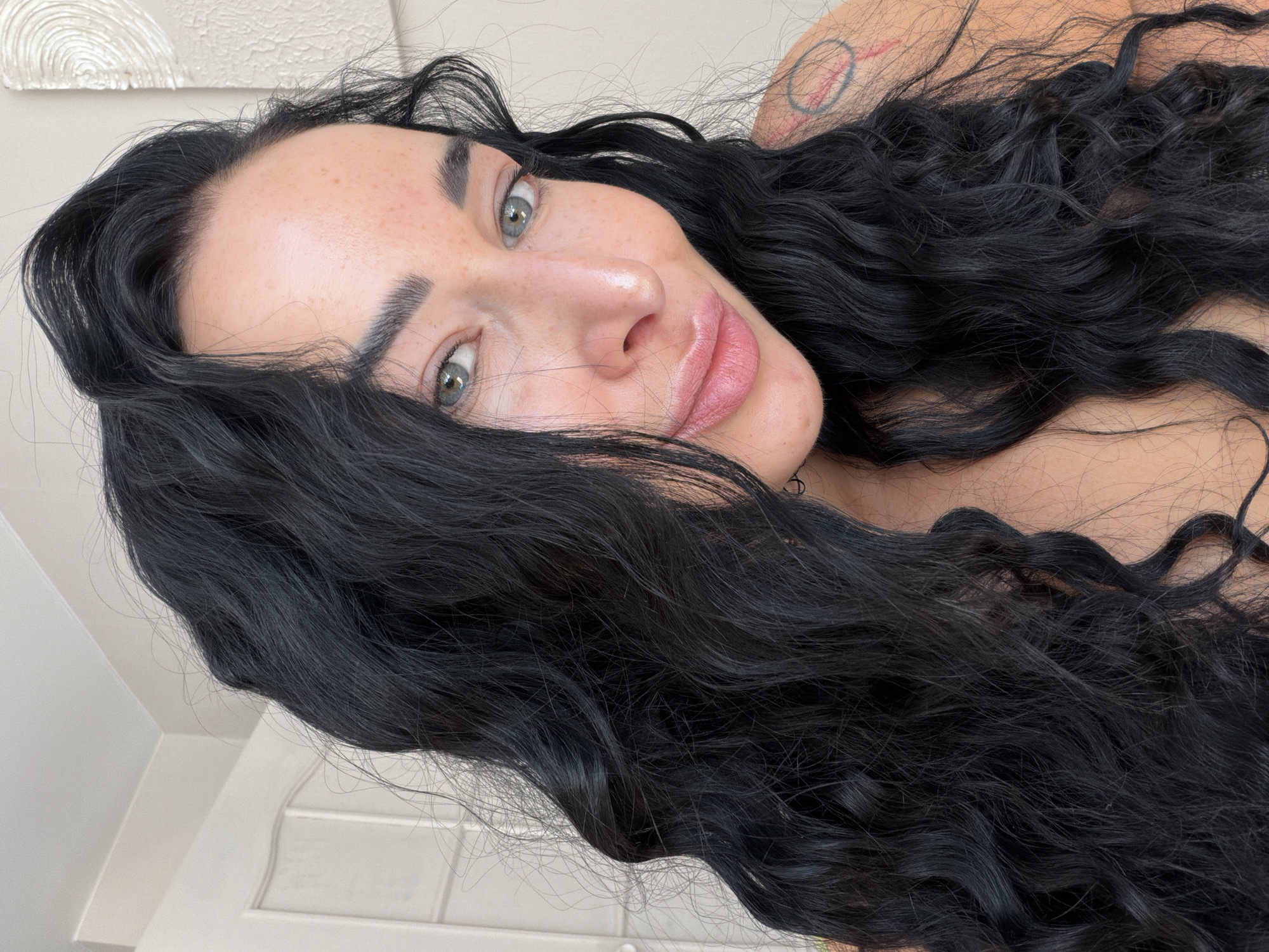 Woman with freckles photographed in close-up portraits