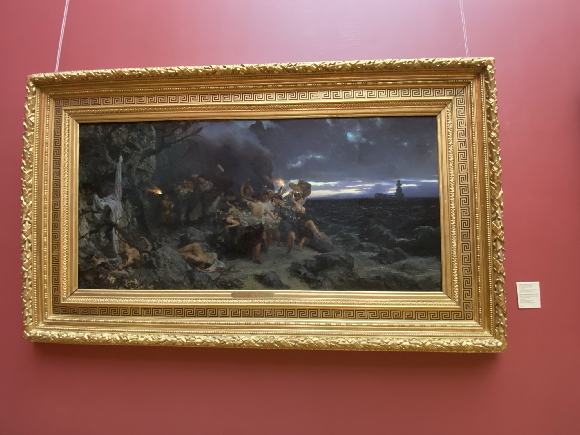 Stormy coastal painting observed on red wall in Moscow