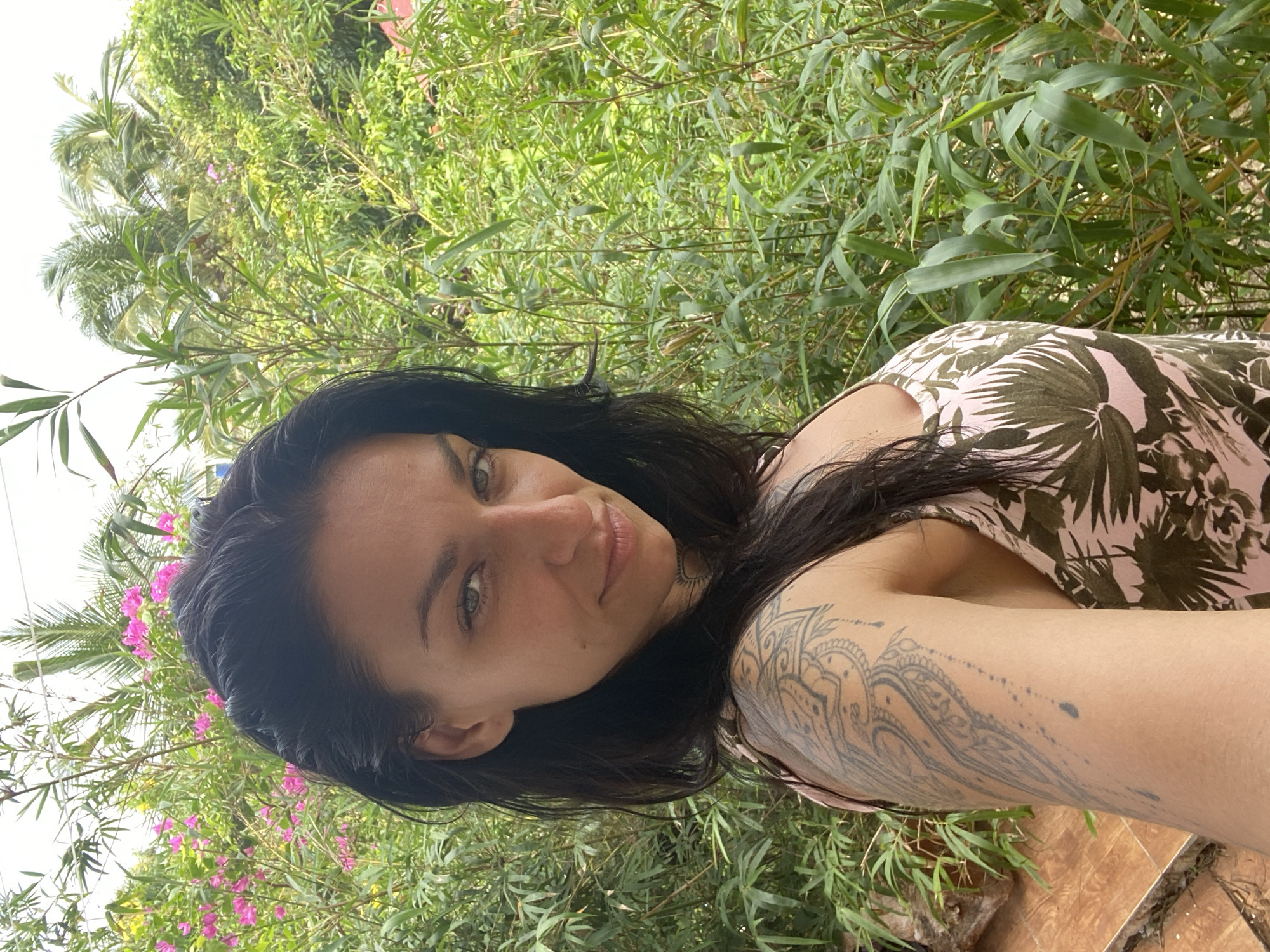 Woman takes morning selfies in tropical Mũi Né setting