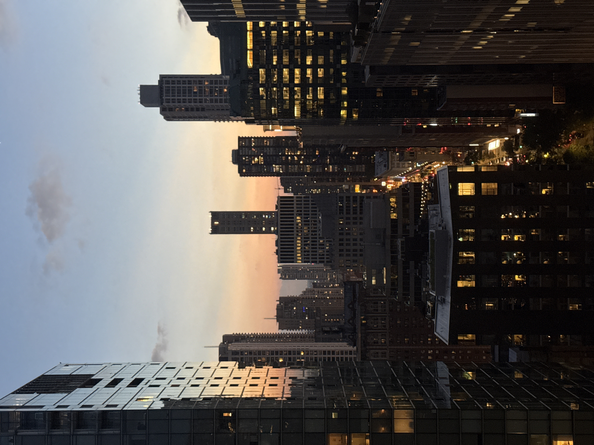 Chicago skyline at dusk, rooftop pool and city lights