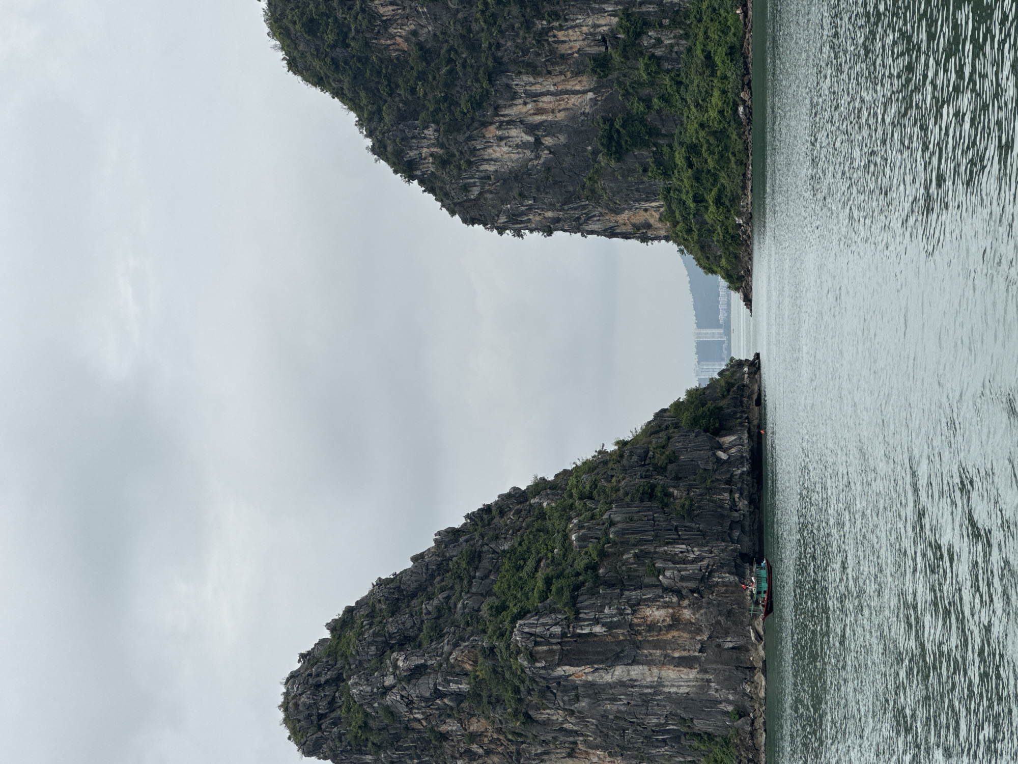 Boats navigating Ha Long Bay's karst-lined waters