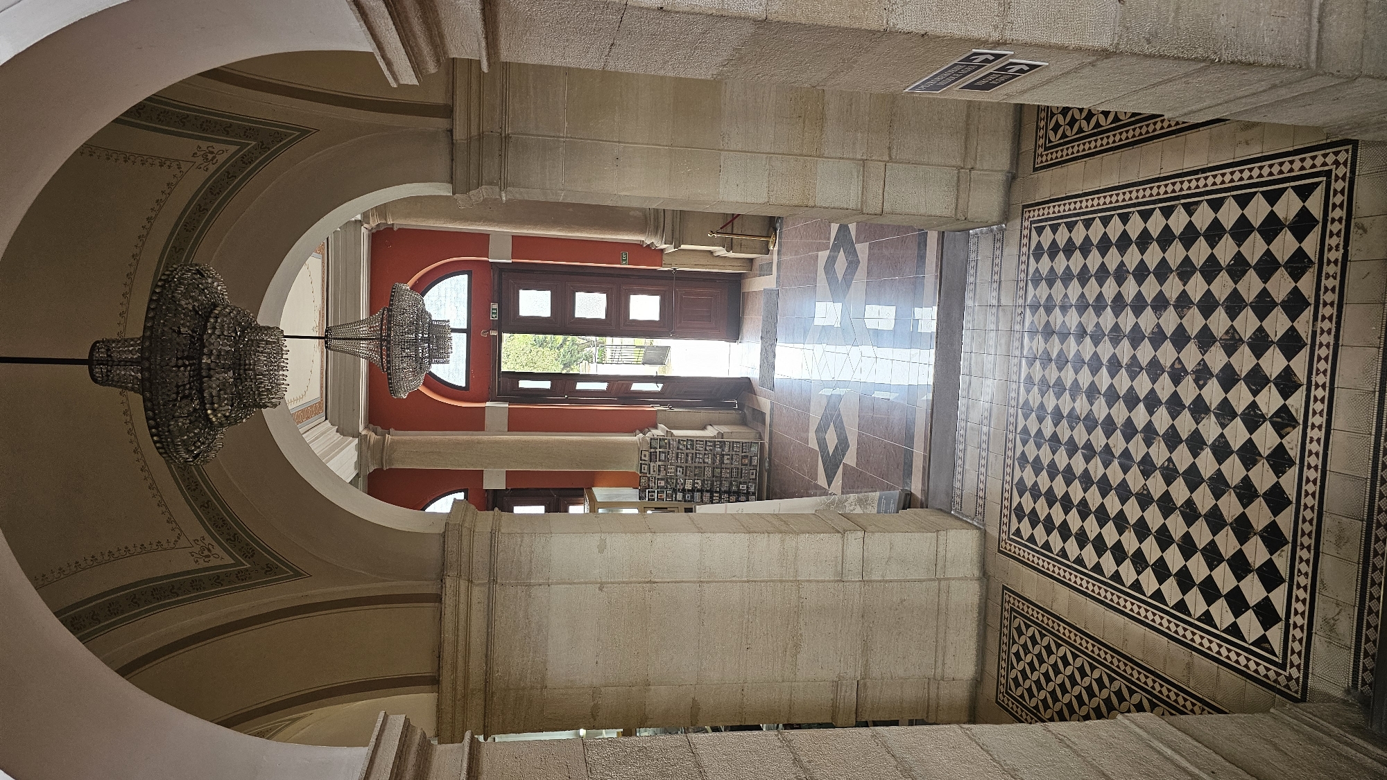 Visitor documents ornate interior of Varna Archaeological Museum