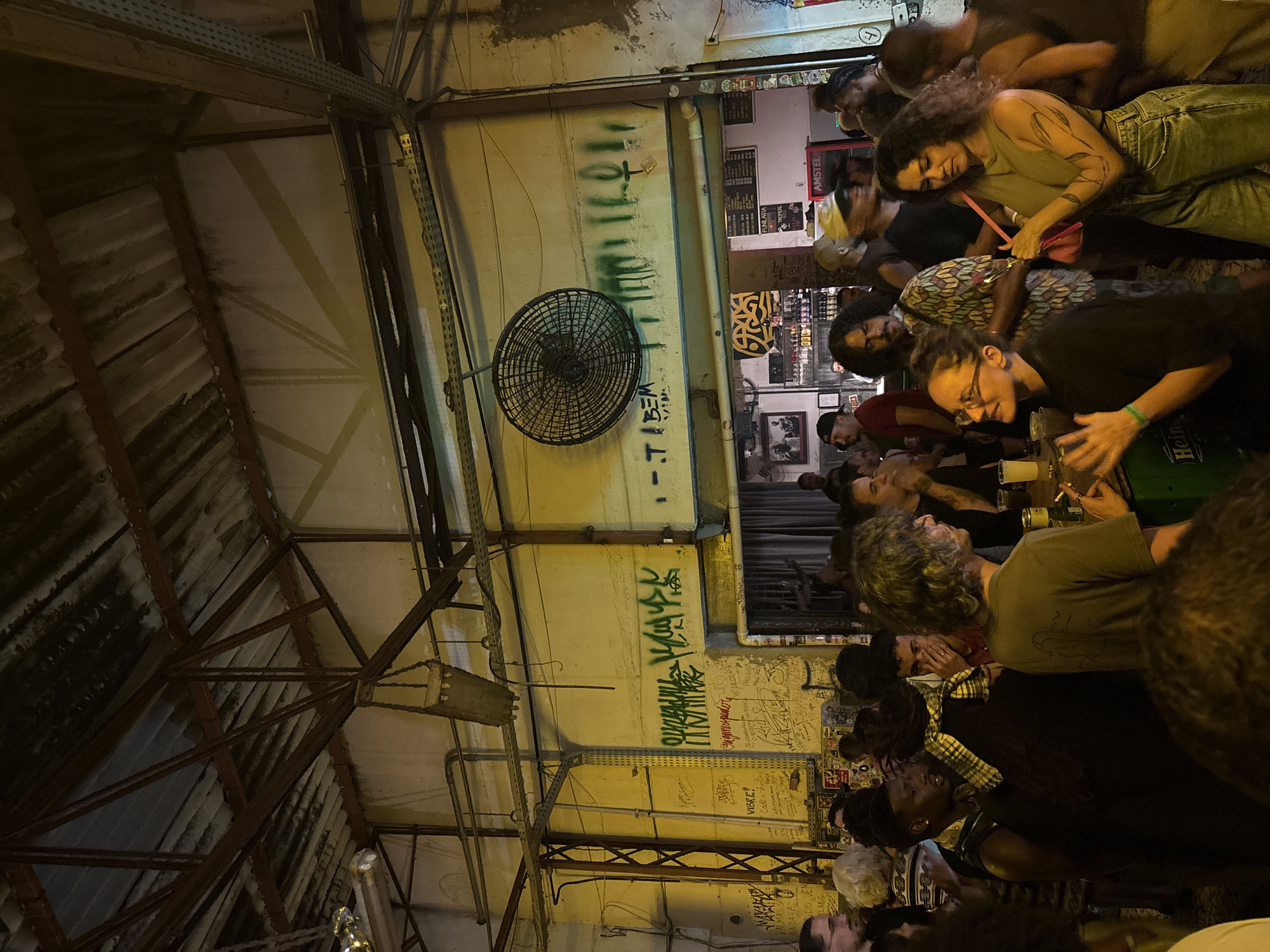 Late-night club scene with live band, DJ performance in São Paulo