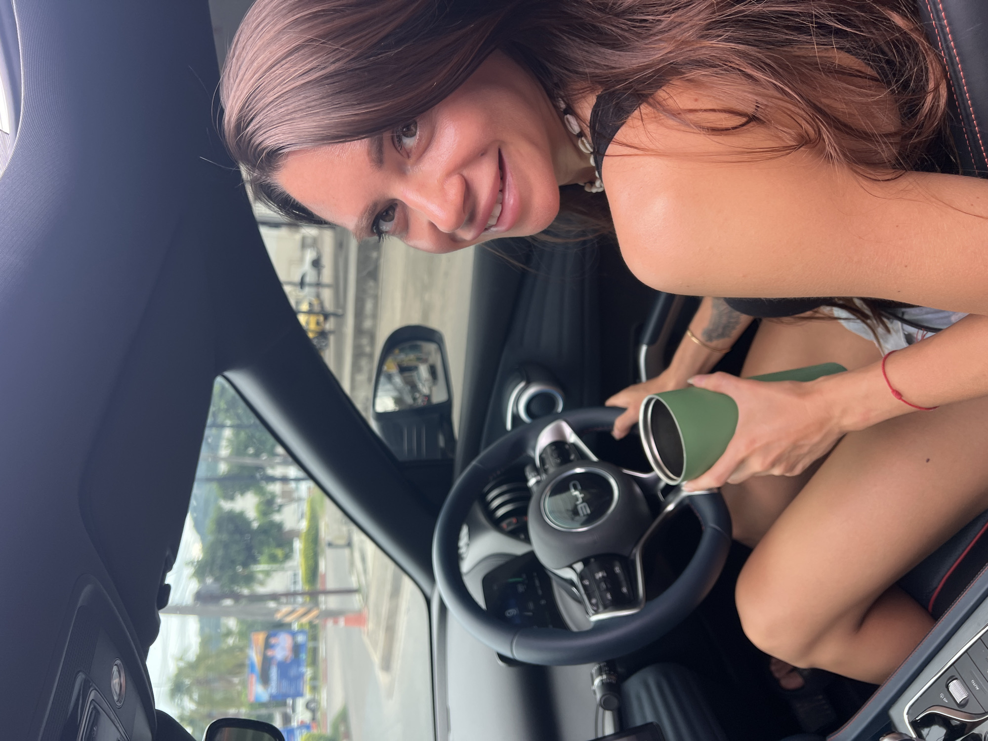 Morning car moment in Ko Samui with a green tumbler