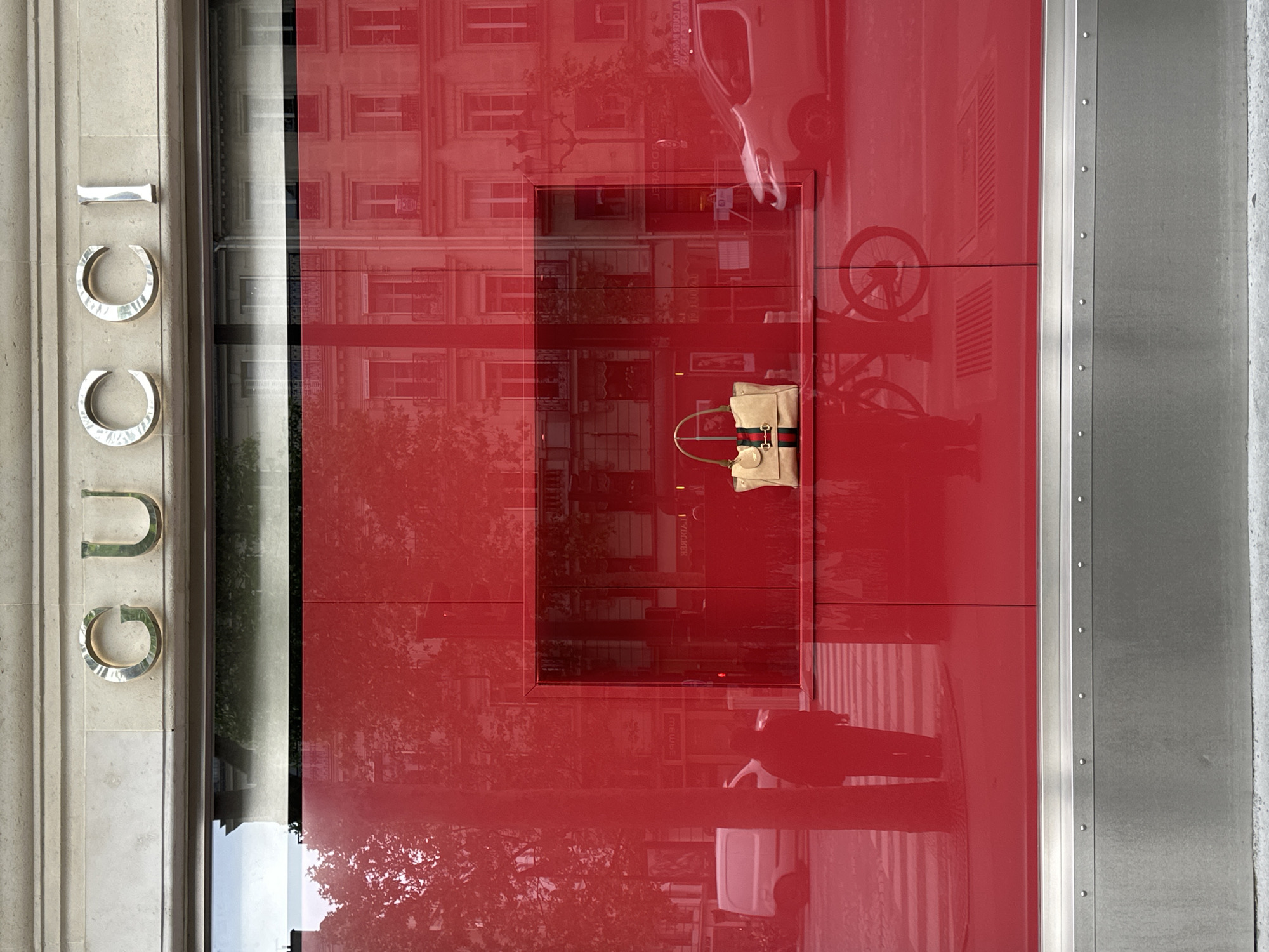 Gucci store exterior observed in Paris morning hours