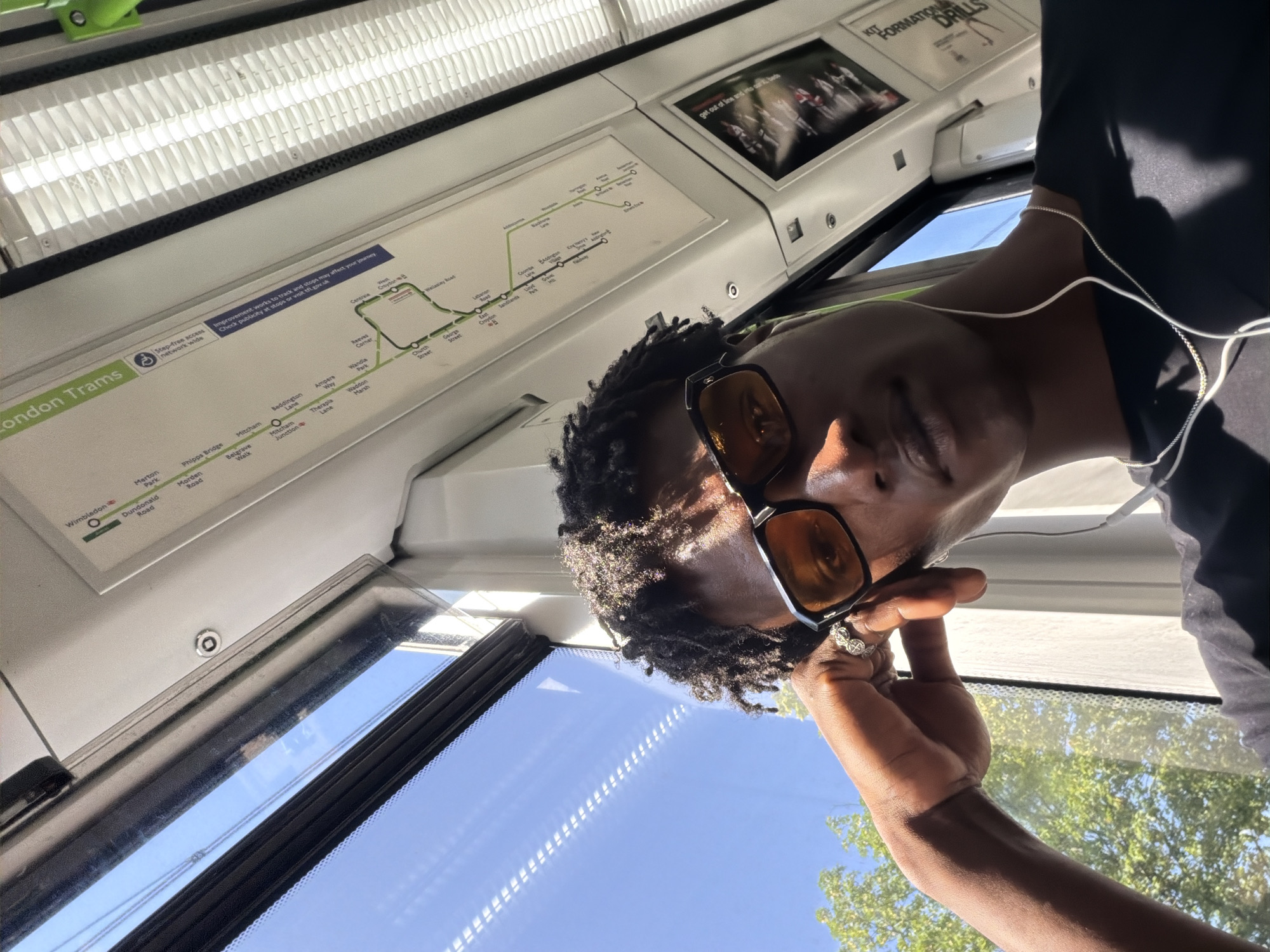 Quiet moment on a London tram or train, mid-journey