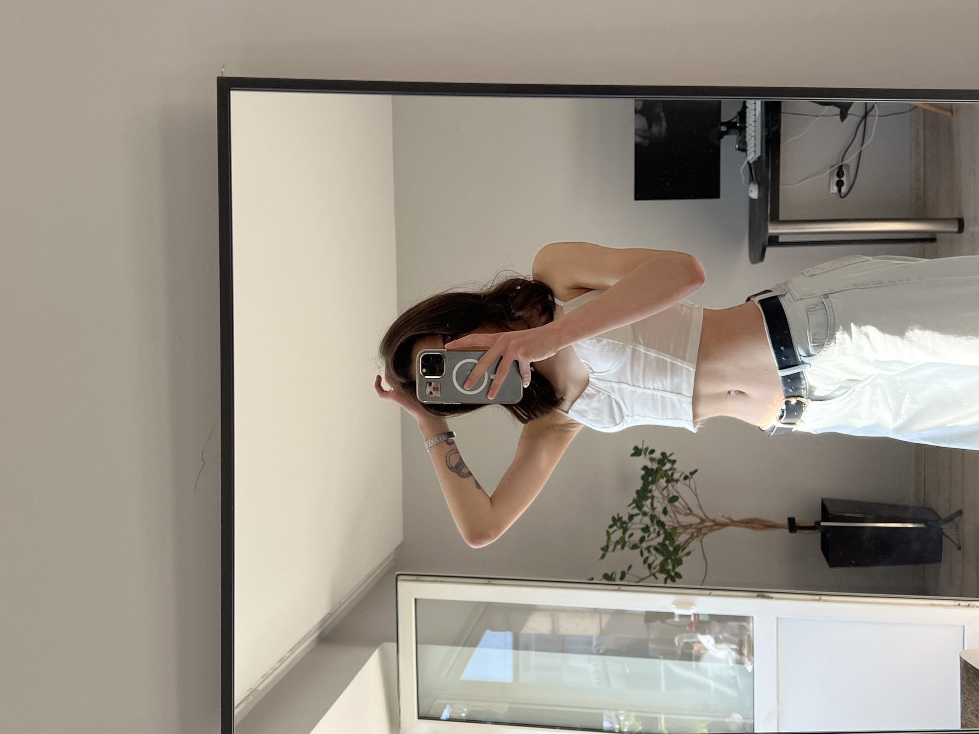 Woman takes mirror selfies in Ternopil residence early morning