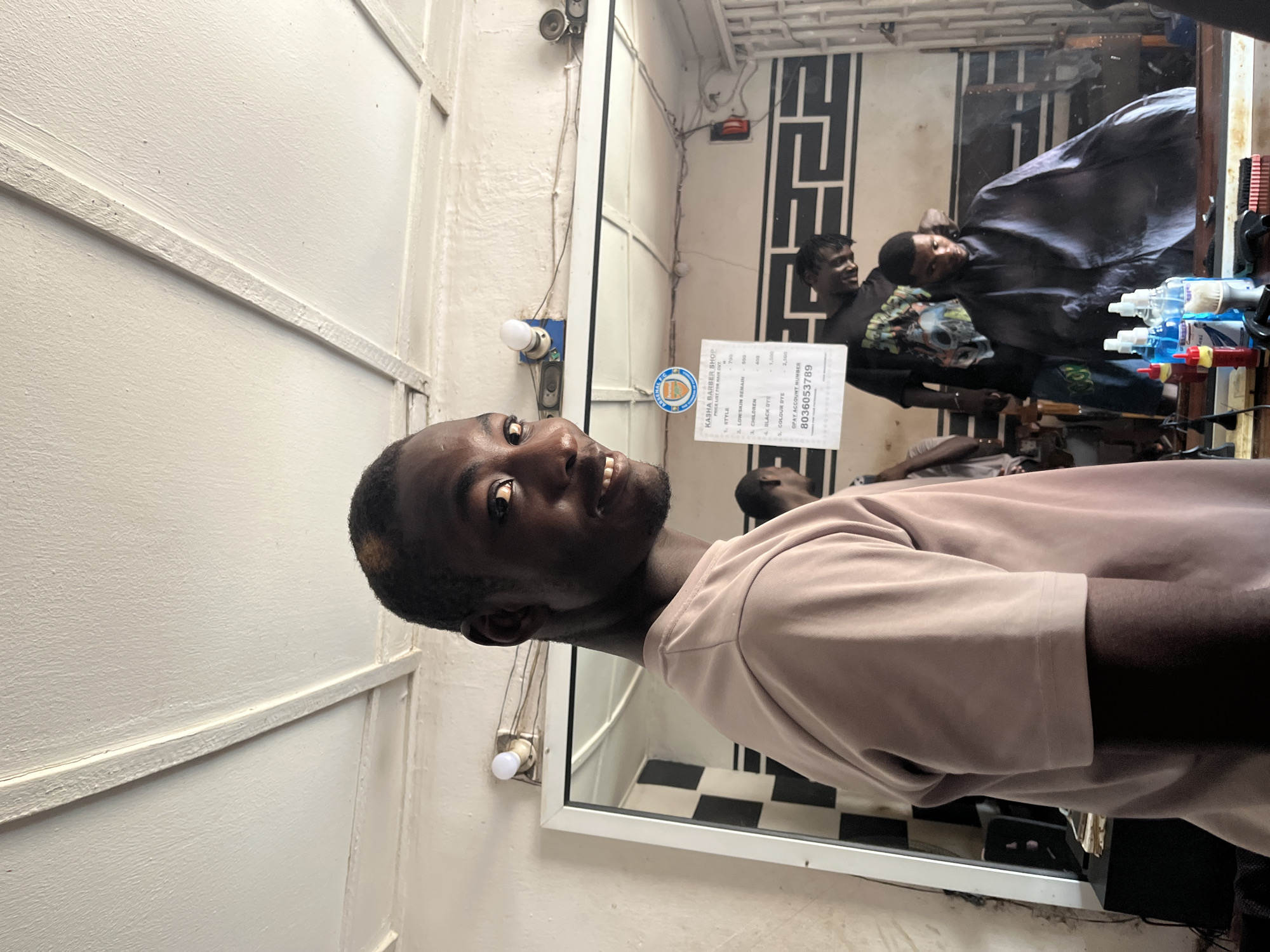 Daily life moments captured in Jos: barber shop, schoolchildren