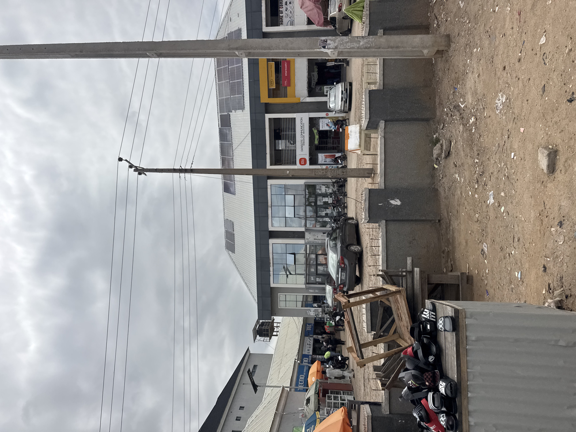 Phone shop browsing and street life in Jalingo, Nigeria