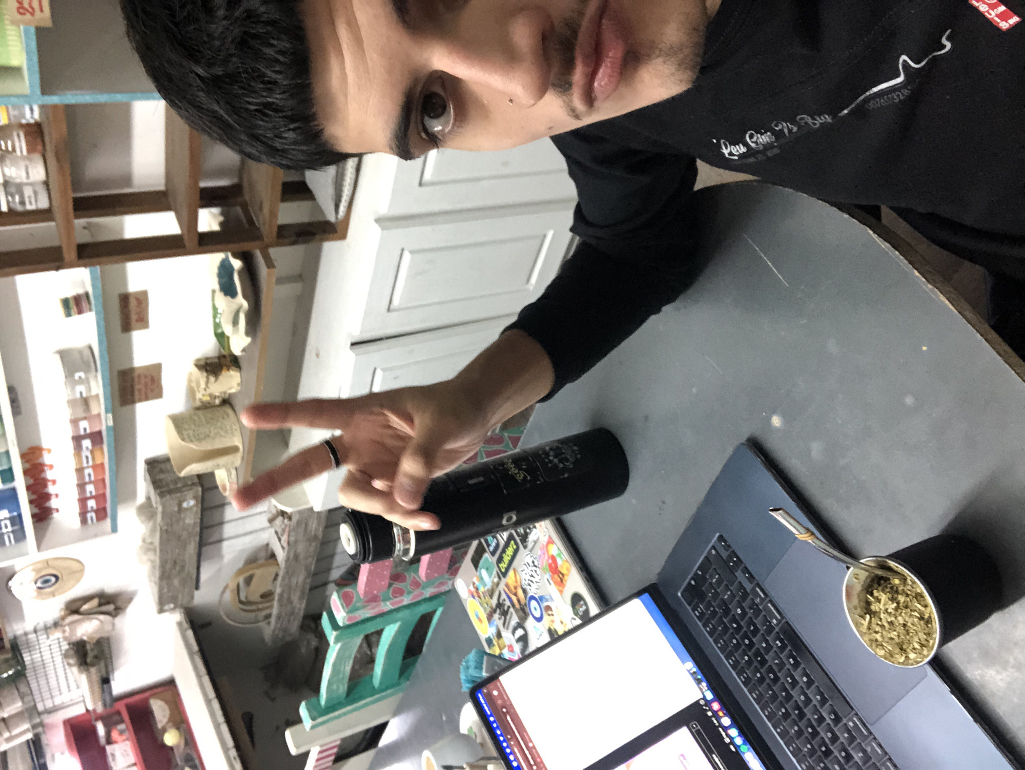 Person makes peace sign gesture in Beccar selfie